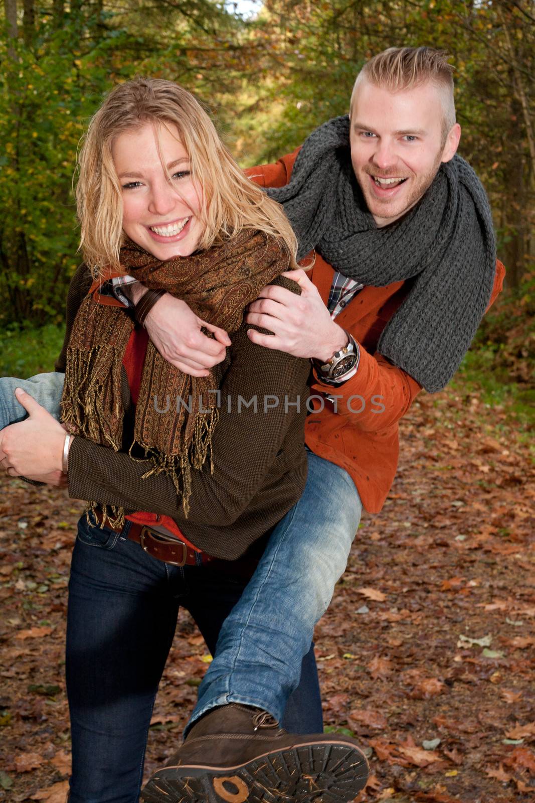 Happy young couple is having a nice time in october