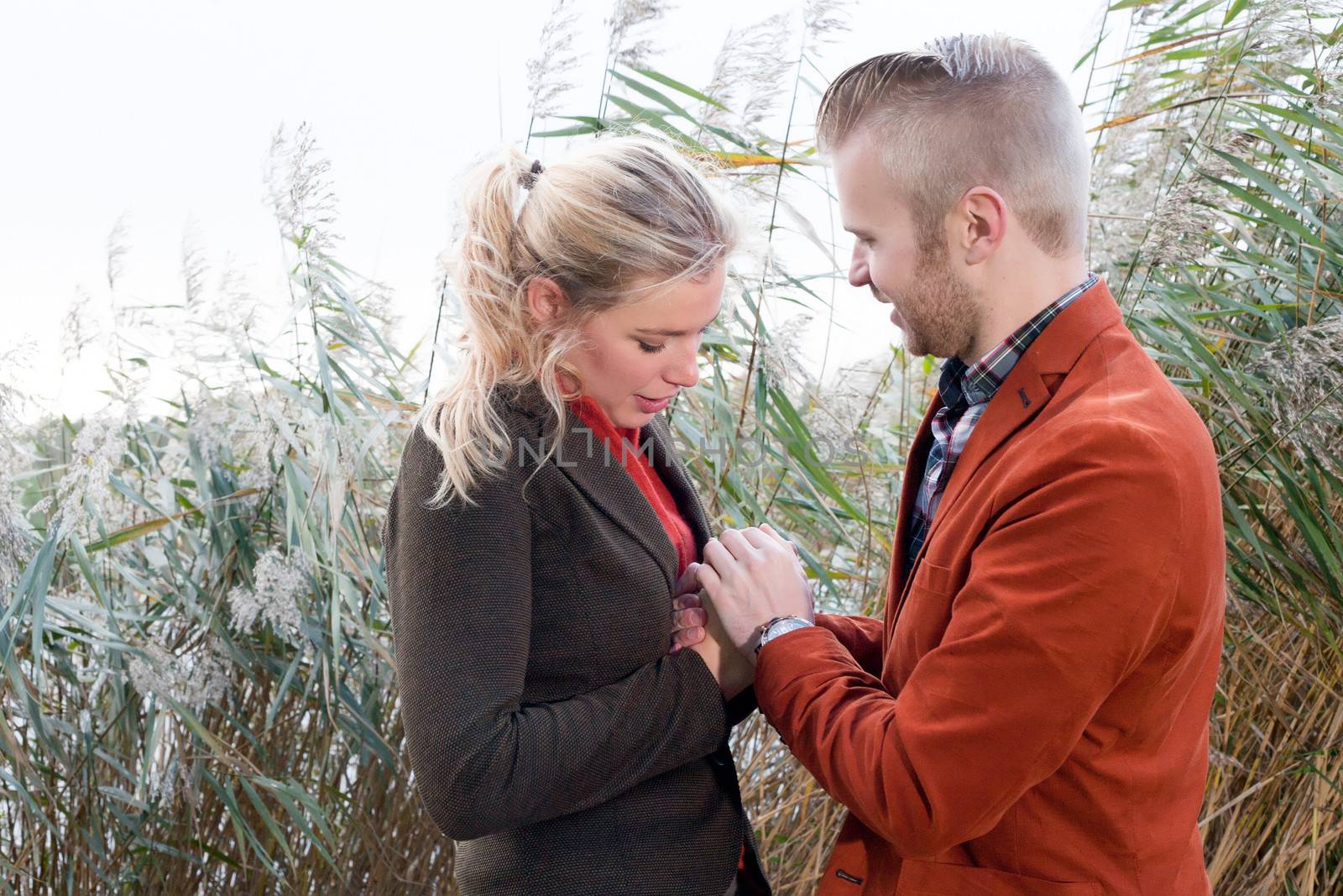 Happy young couple is having a nice time in october