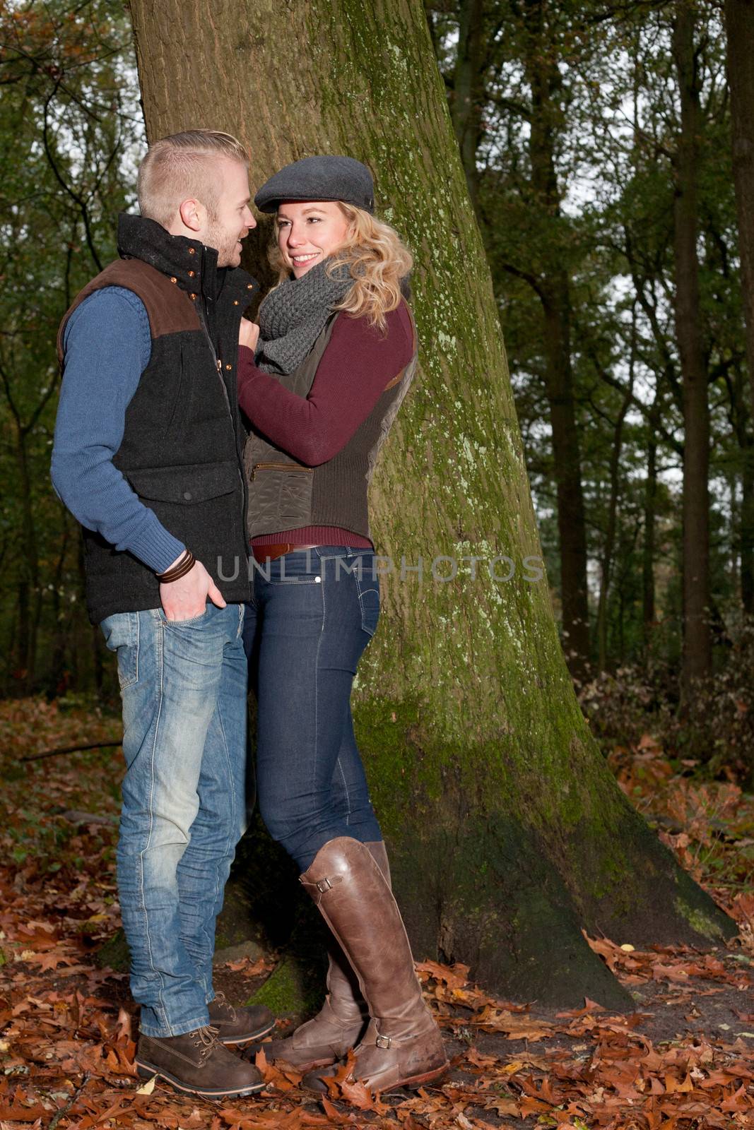 Happy young couple is having a nice time in october