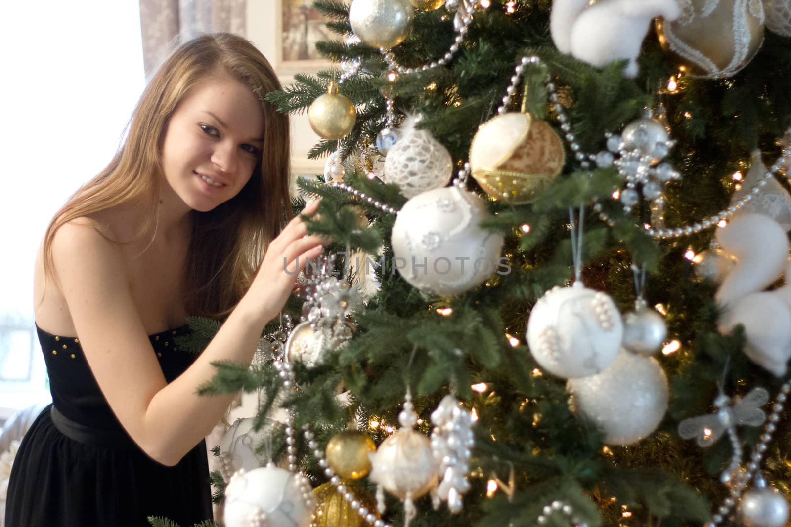 girl near Christmas tree home