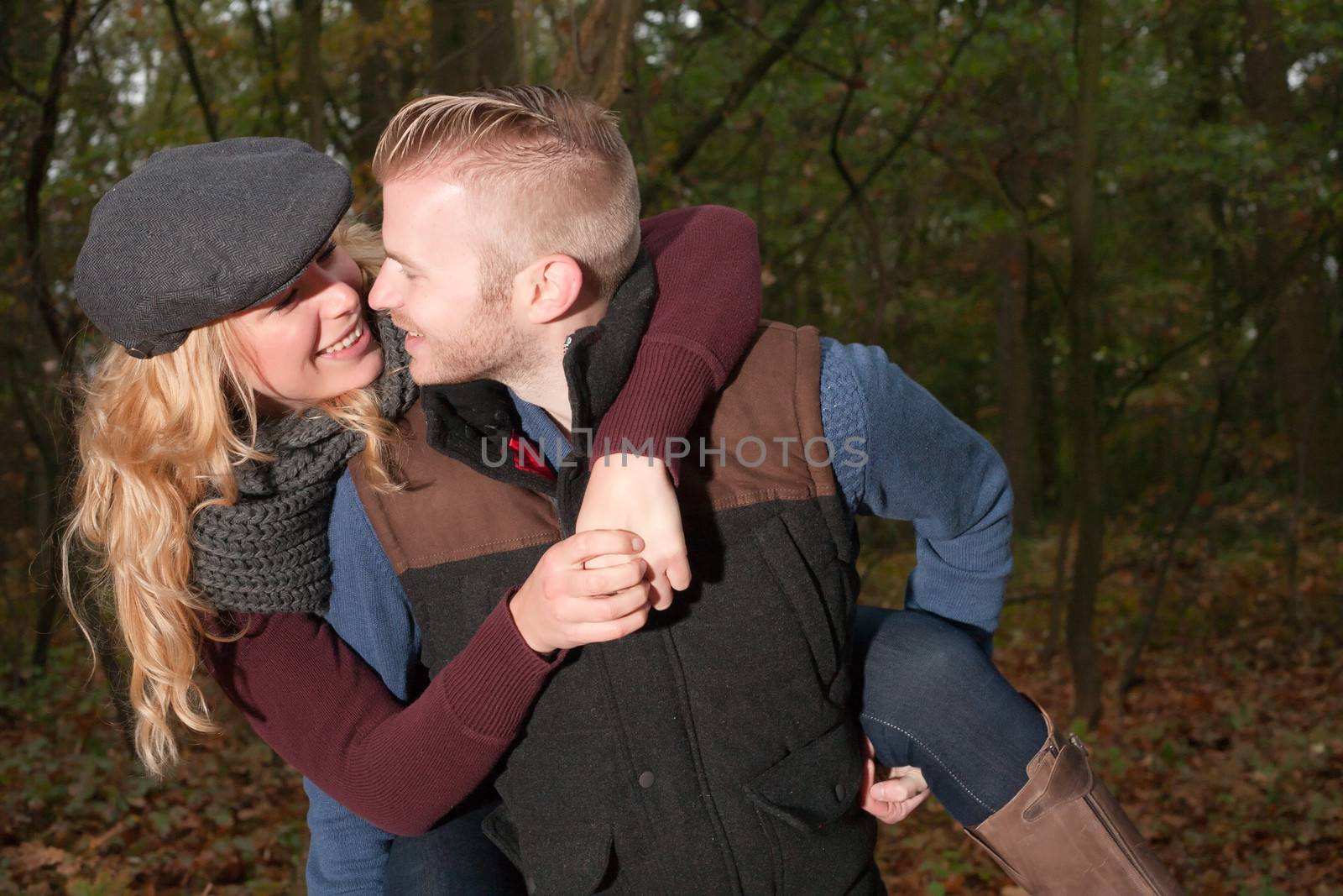 Happy young couple is having a nice time in october