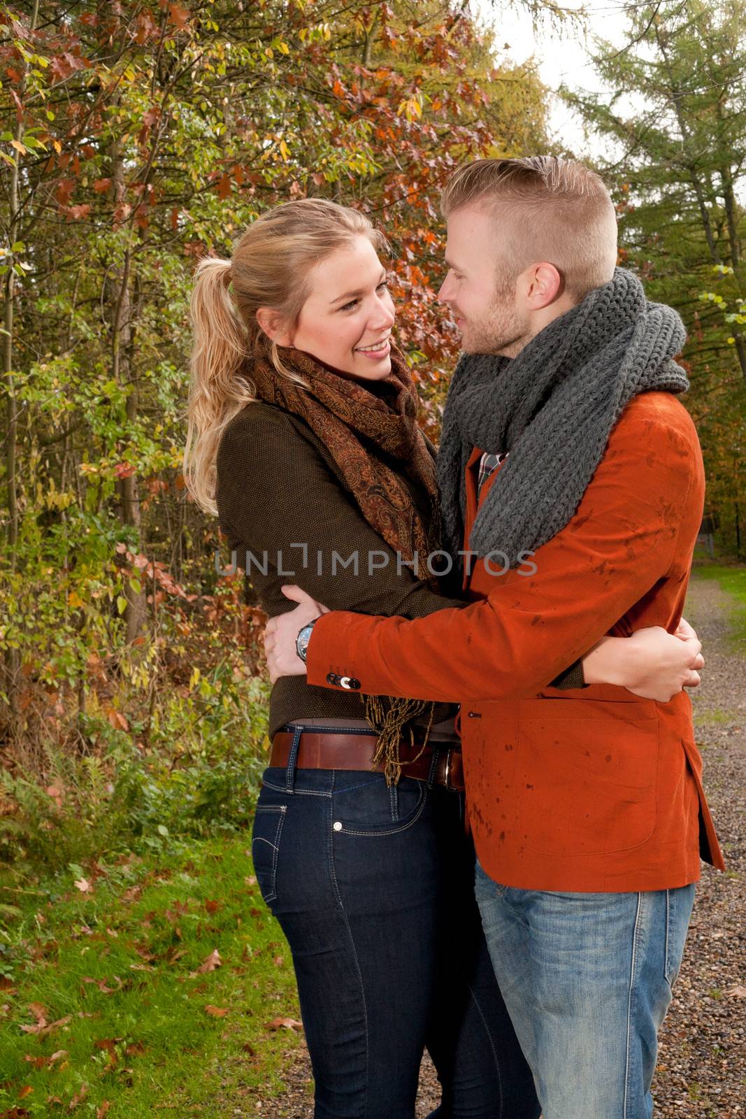 Happy young couple is having a nice time in october