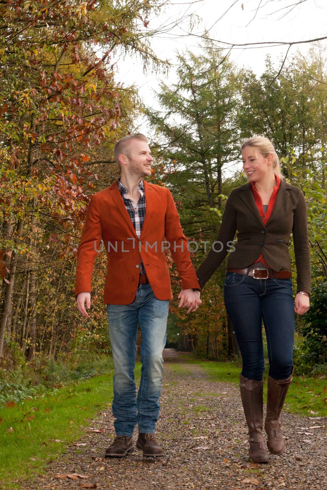 Happy young couple is having a nice time in october