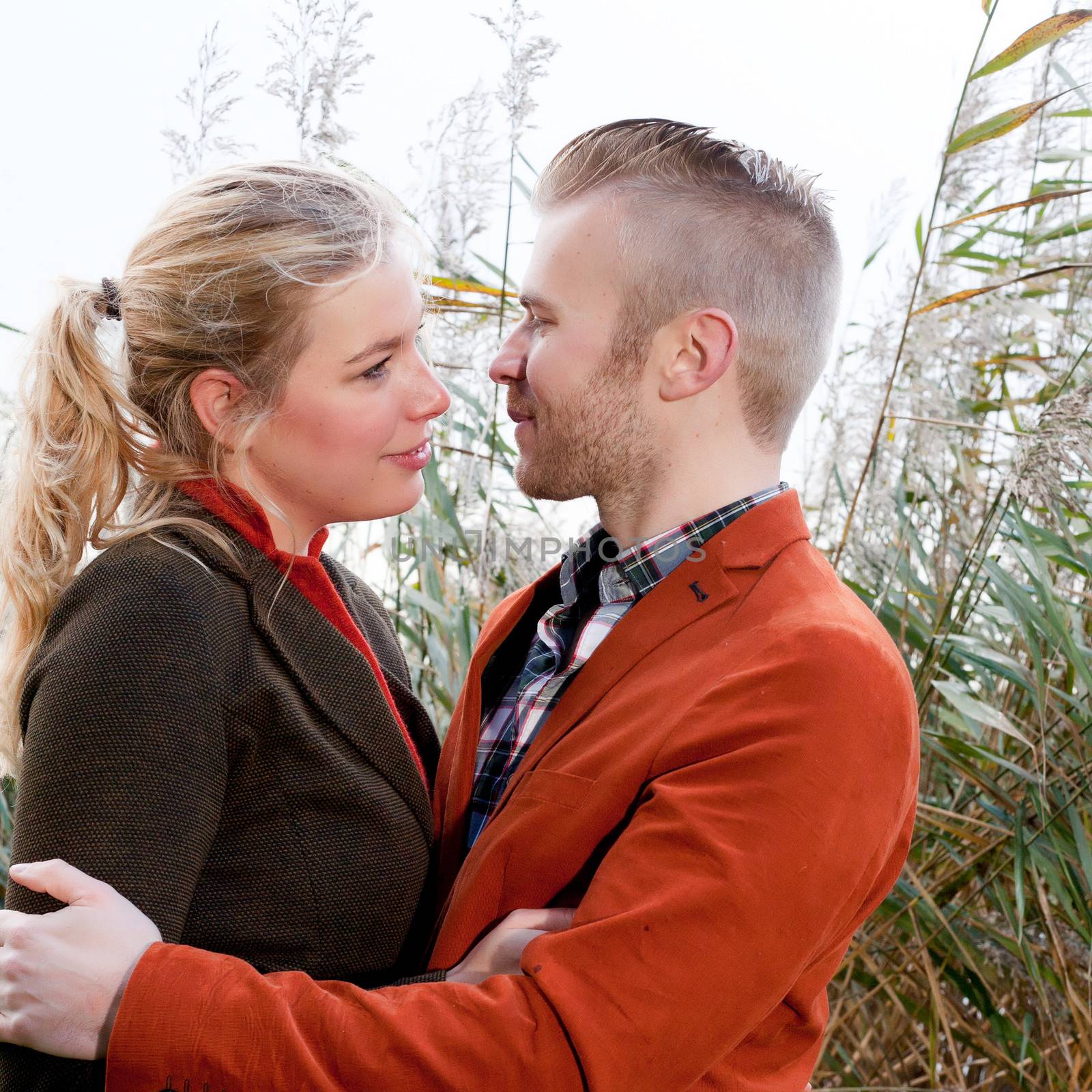 Happy young couple is having a nice time in october