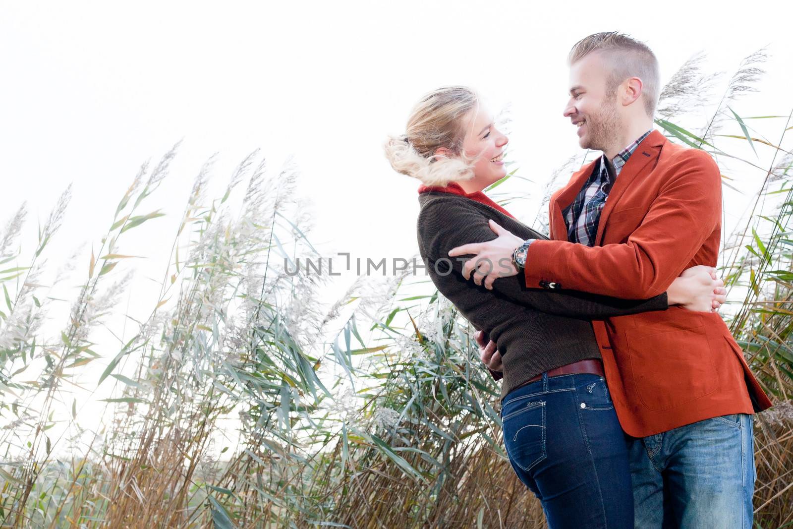 Happy young couple is having a nice time in october