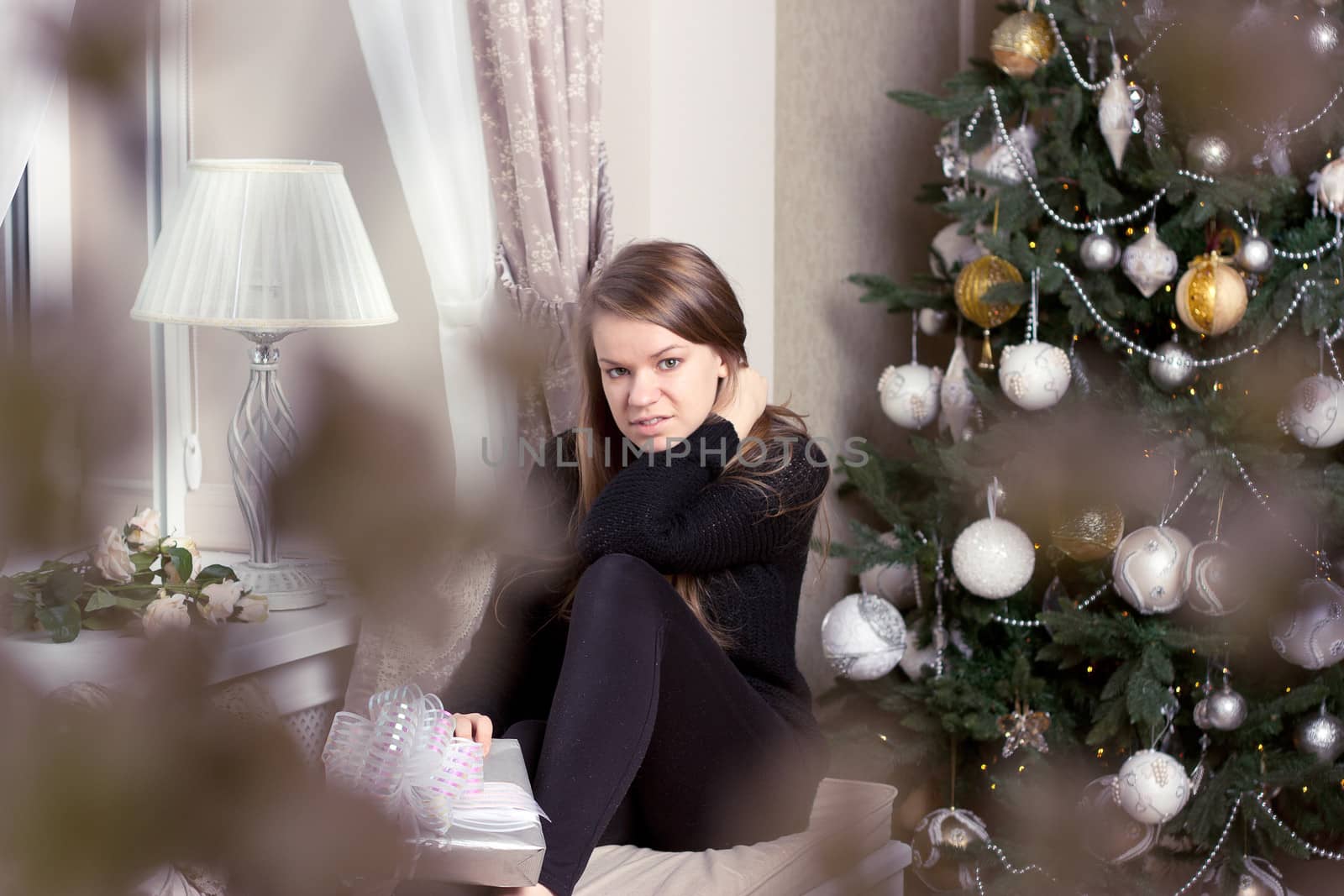 girl near Christmas tree home