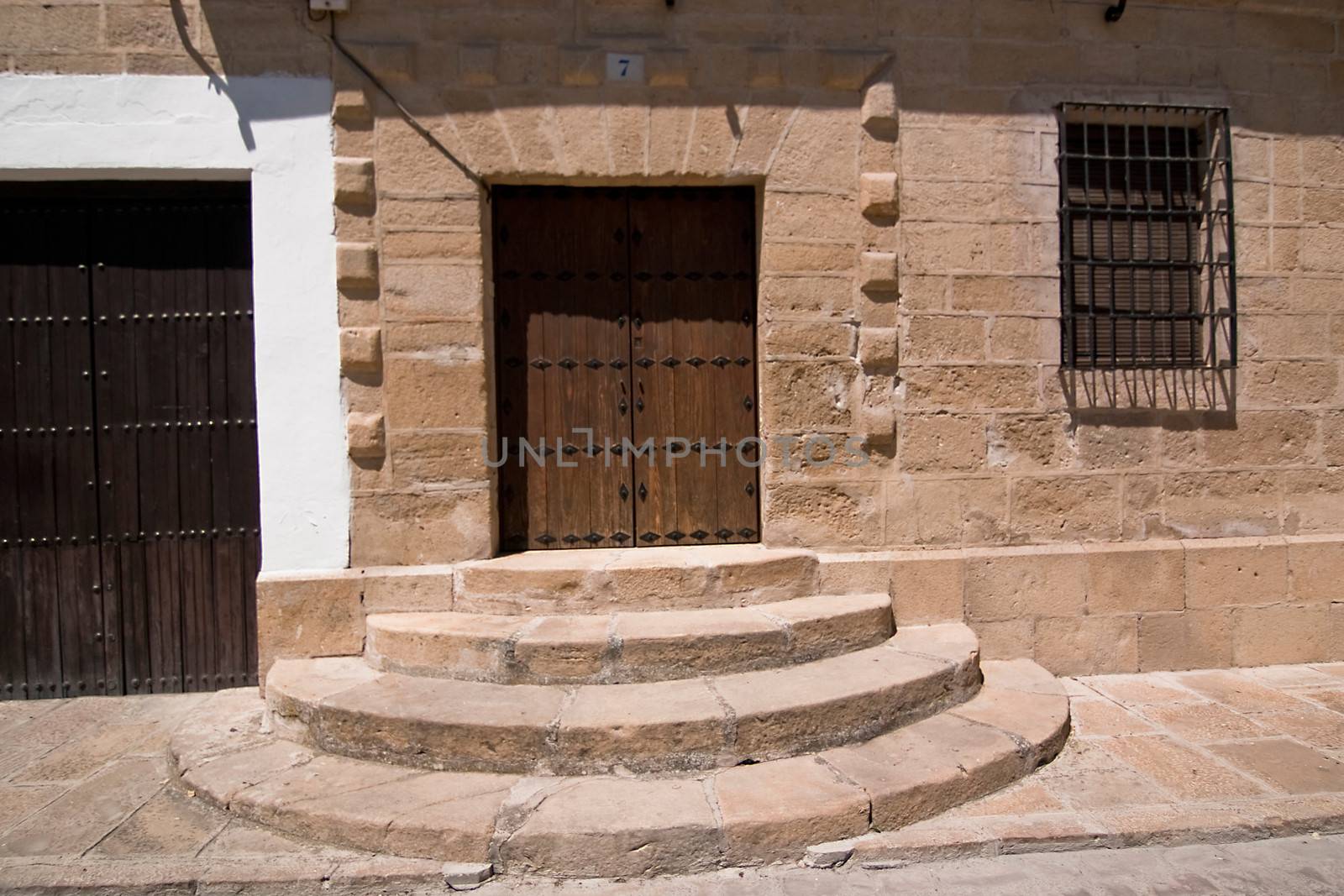 Access door with rounded stairs in Sabiote, Jaen, Spain