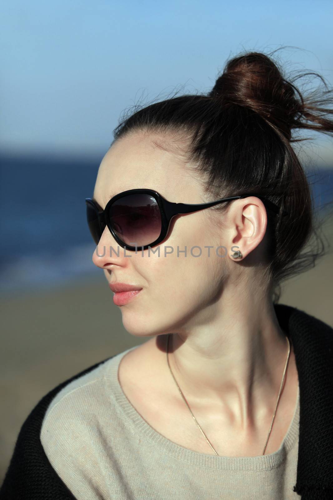 The girl with smile in solar glasses