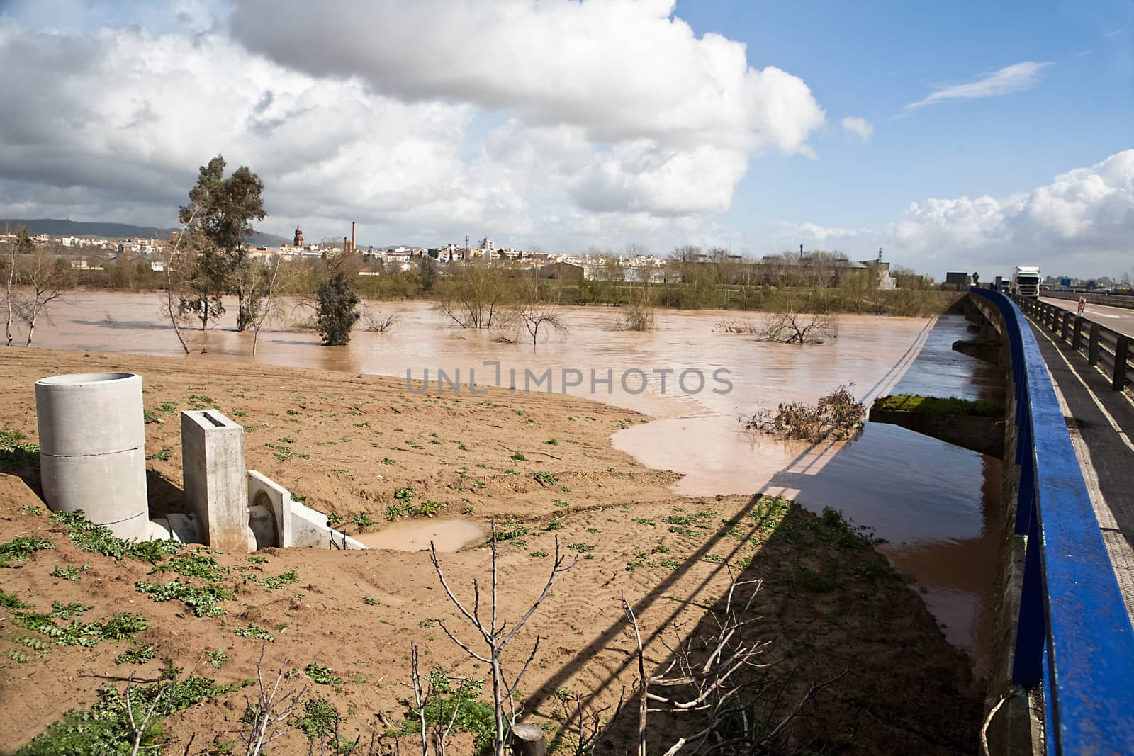 Guadalquivir river overflowed to its passage over the bridge of a road, Andujar, Jaen province, Andalusia, Spain