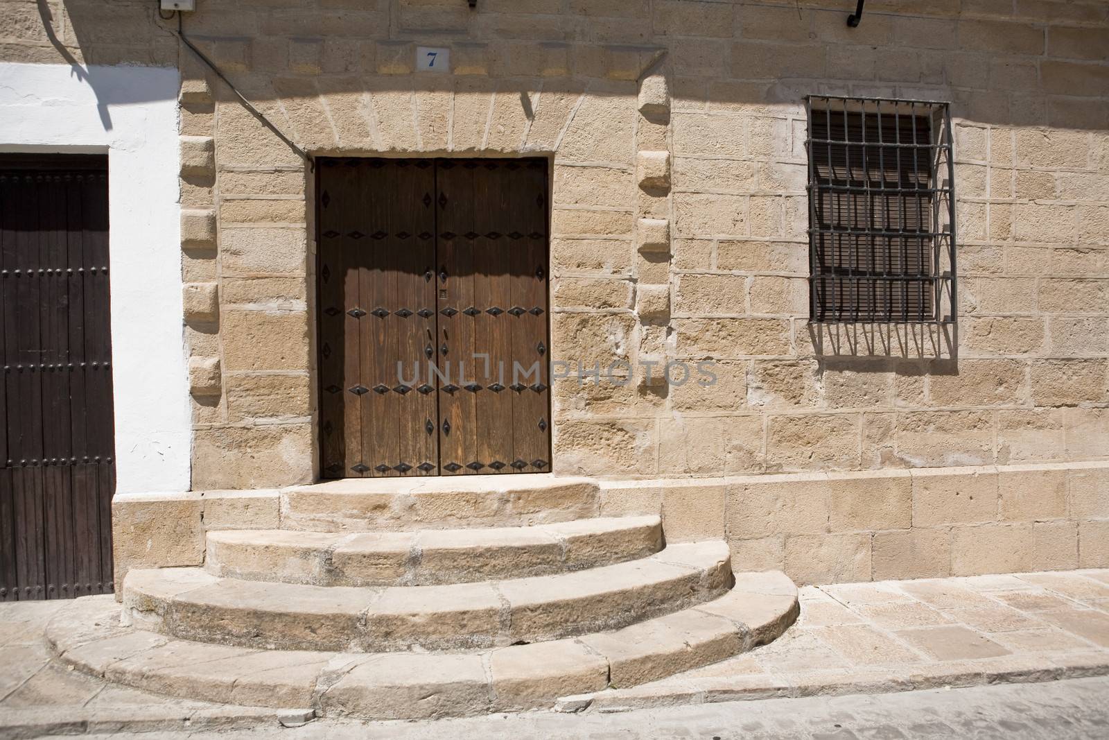 Wooden door in a village of Sabiote, Jaen province, Andalusia, Spain