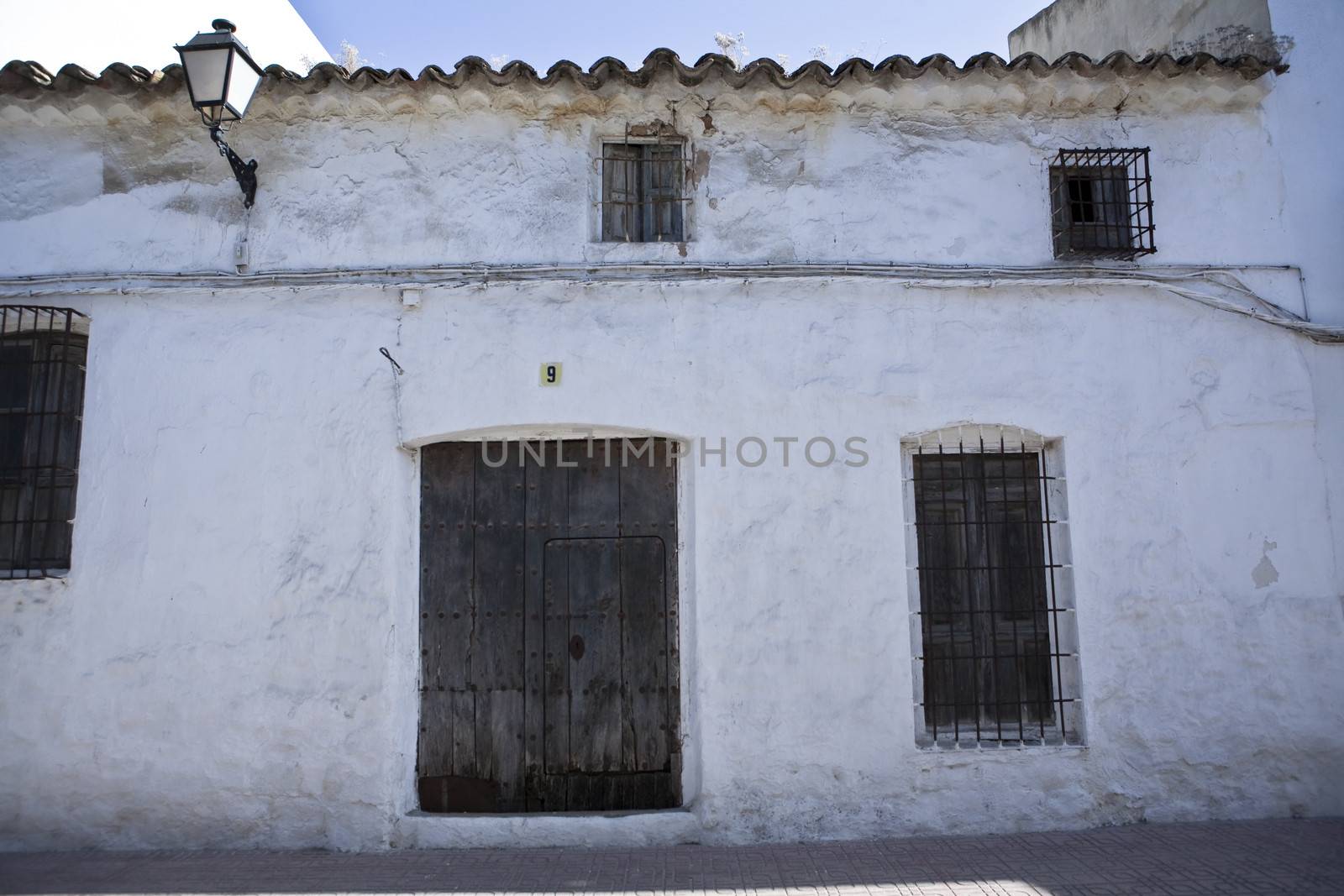 Typical facade of whitewashed house in Sabiote, Jaen, Spain