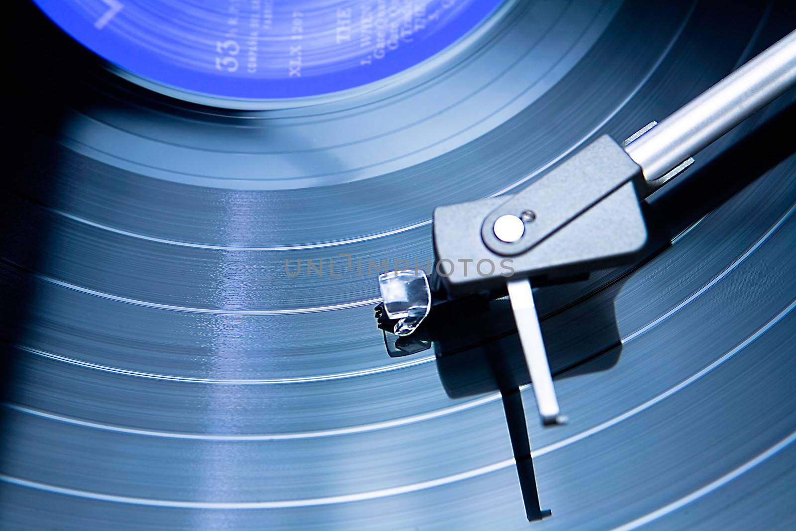 Vintage record player with spinning vinyl. 