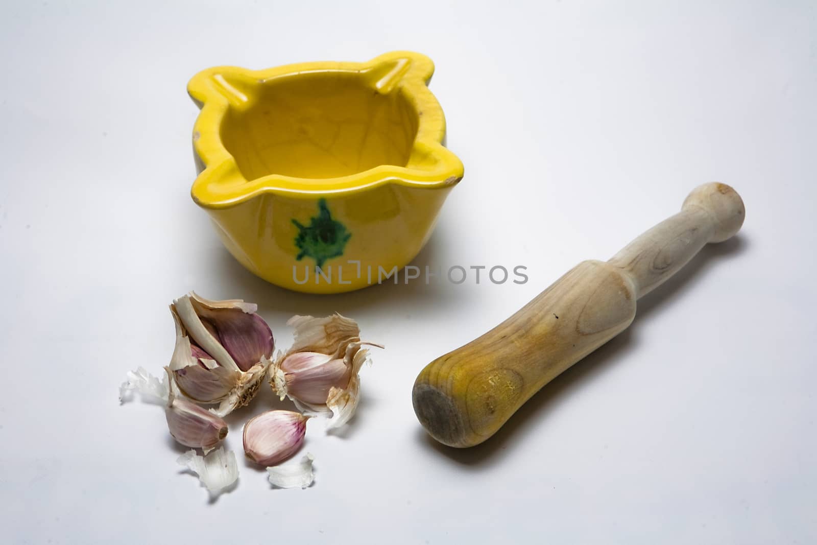   Ceramic mortar and garlic, used in the Spanish traditional kitchen, Spain