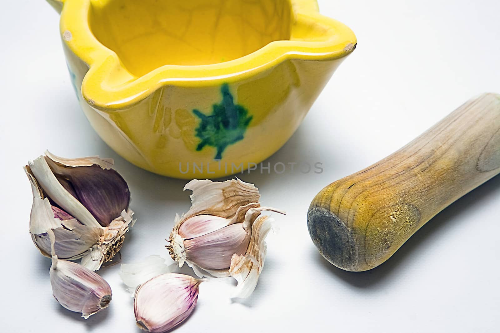   Ceramic mortar and garlic, used in the Spanish traditional kitchen, Spain
