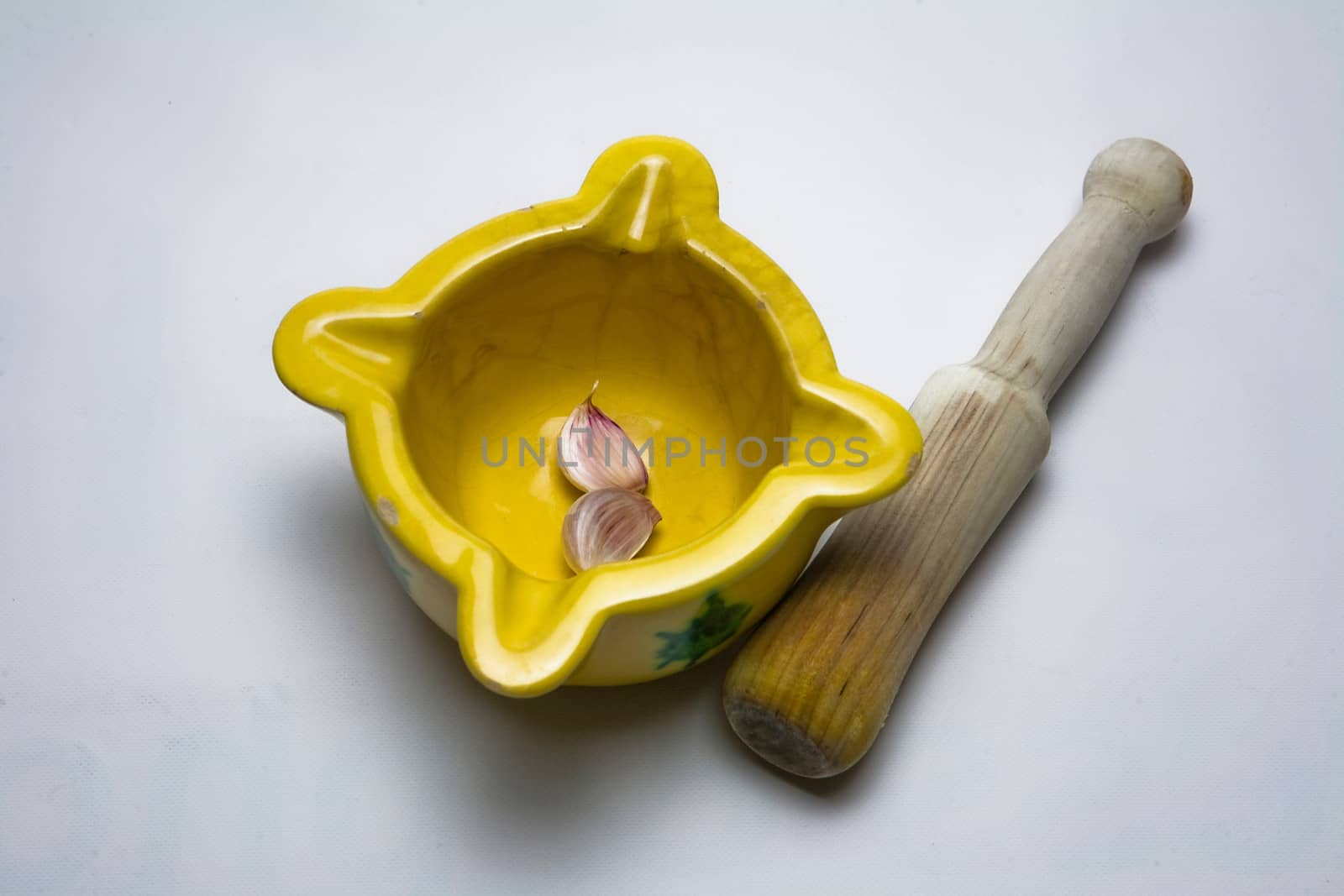   Ceramic mortar and garlic, used in the Spanish traditional kitchen, Spain