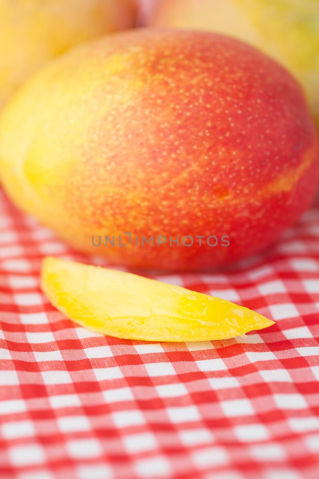 mango fruit on checkered fabric by jannyjus