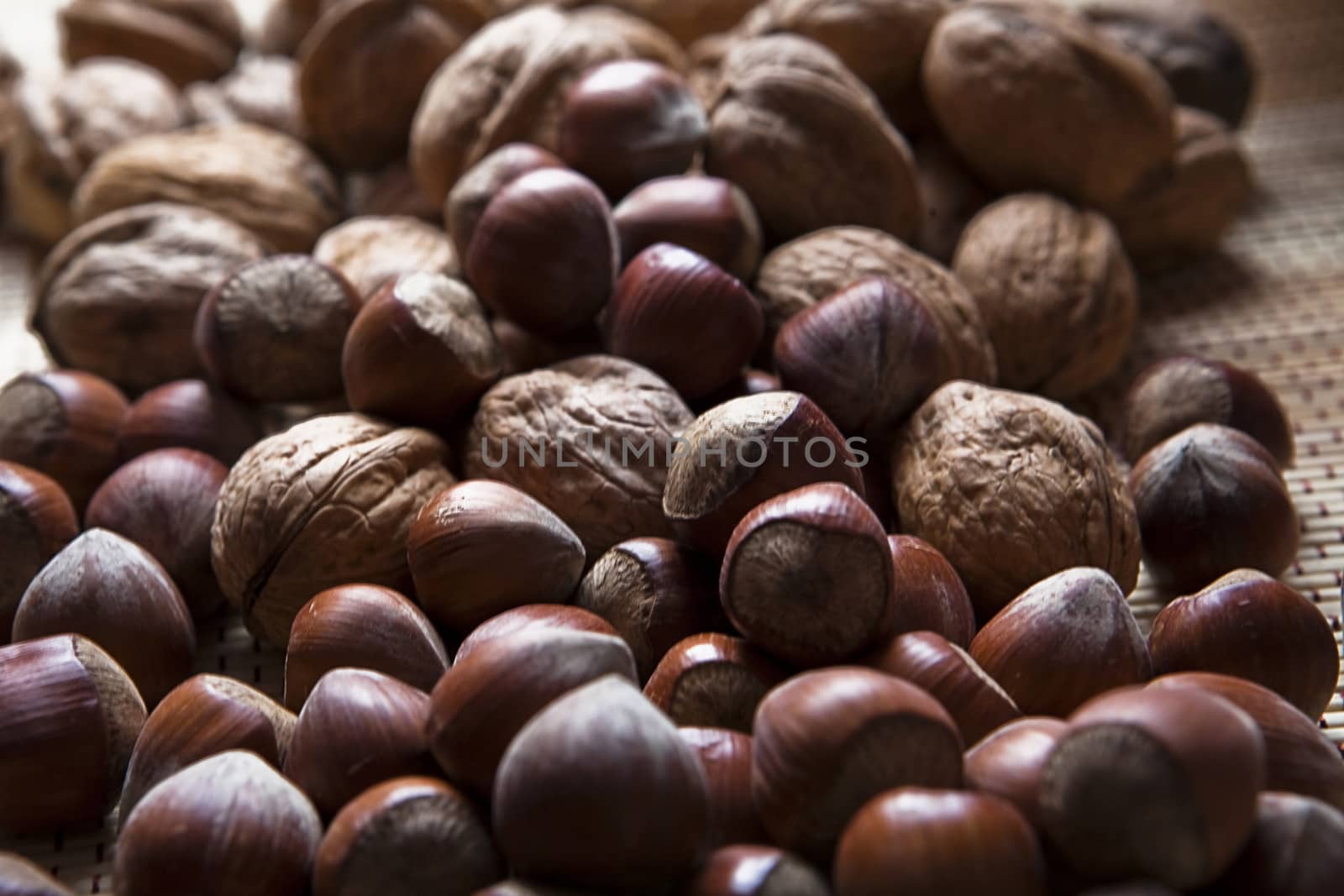 Walnuts and hazelnuts stacked in a pile