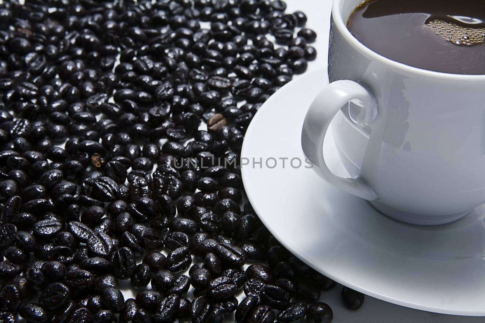 Traditional cup of coffee and coffee beans roasted