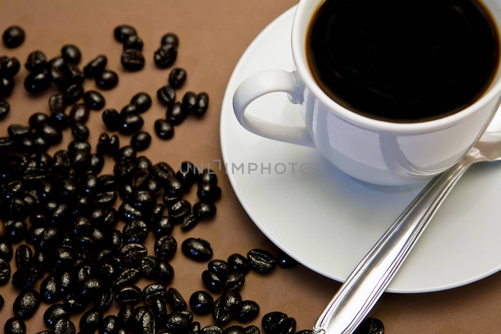  Traditional cup of coffee and coffee beans roasted