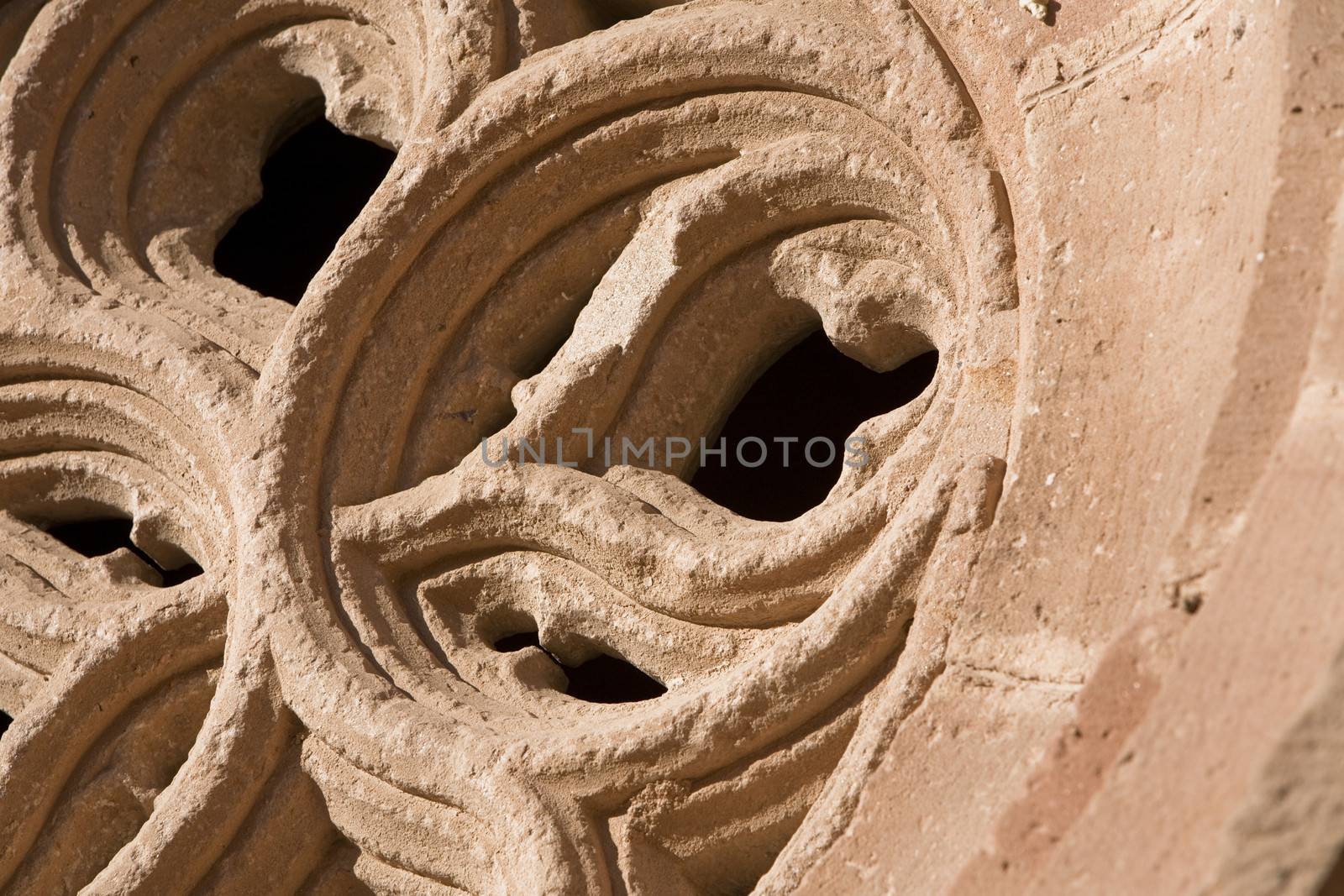 Occulus gothic. Details of the front of the side entry of the Church of Santa Maria, Linares, Jaen province, Andalusia, Spain