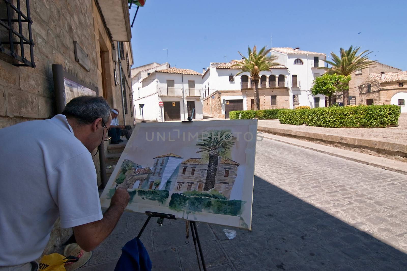Painter paint a square of Sabiote, Jaen province, Andalusia, Spain