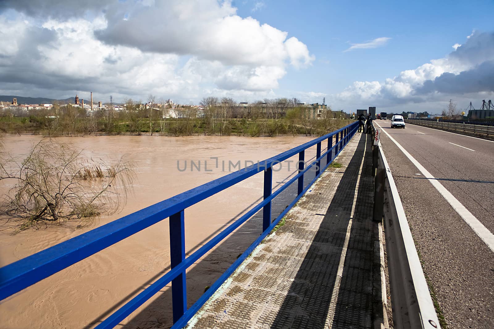 Guadalquivir river overflowed to its passage over the bridge of a road, Andujar, Jaen province, Spain