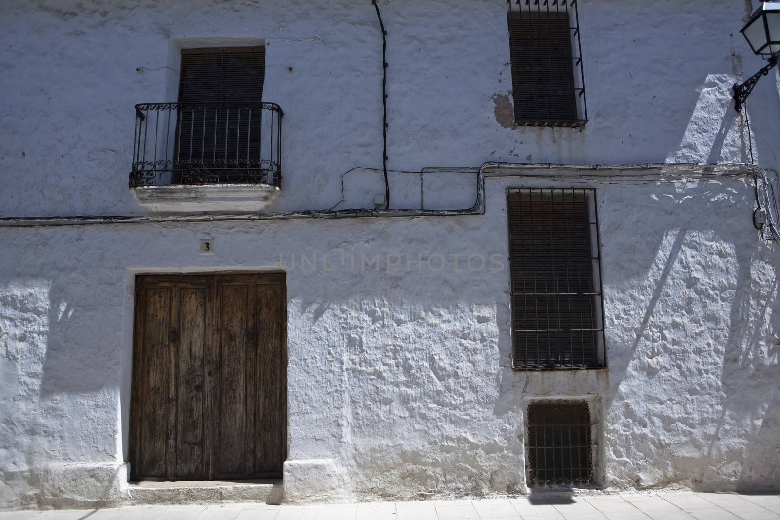 Typical facade of whitewashed house in Sabiote, Jaen province, Andalusia, Spain