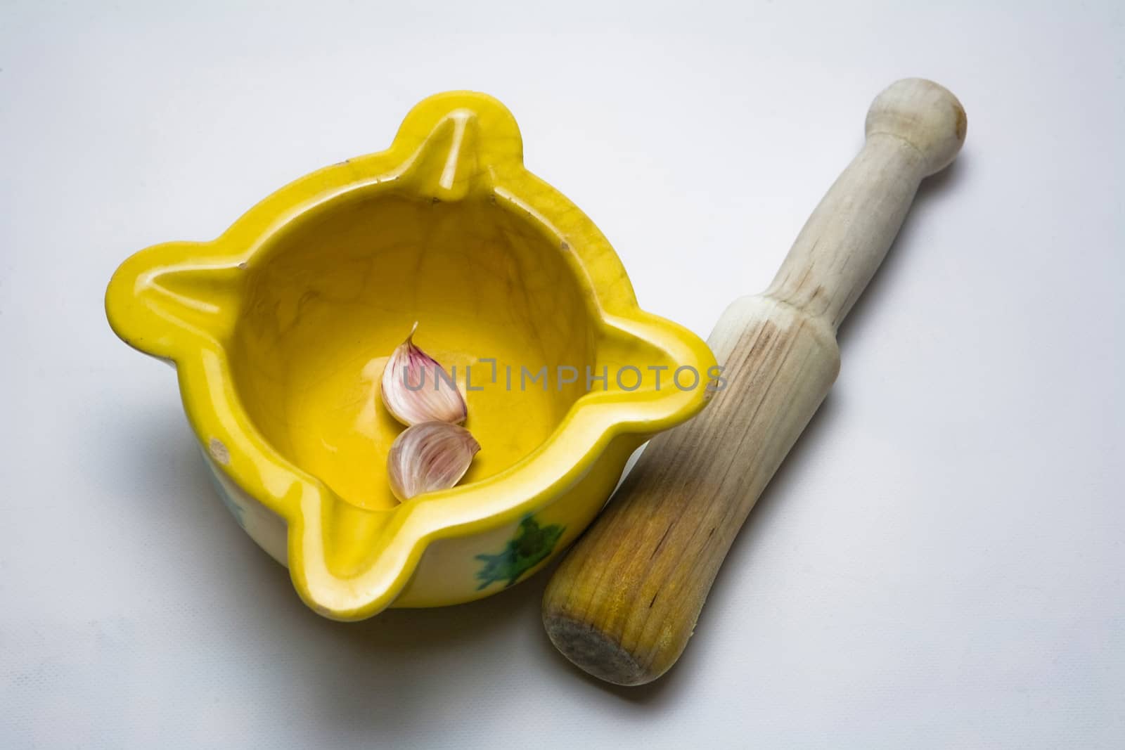   Ceramic mortar and garlic, used in the Spanish traditional kitchen, Spain