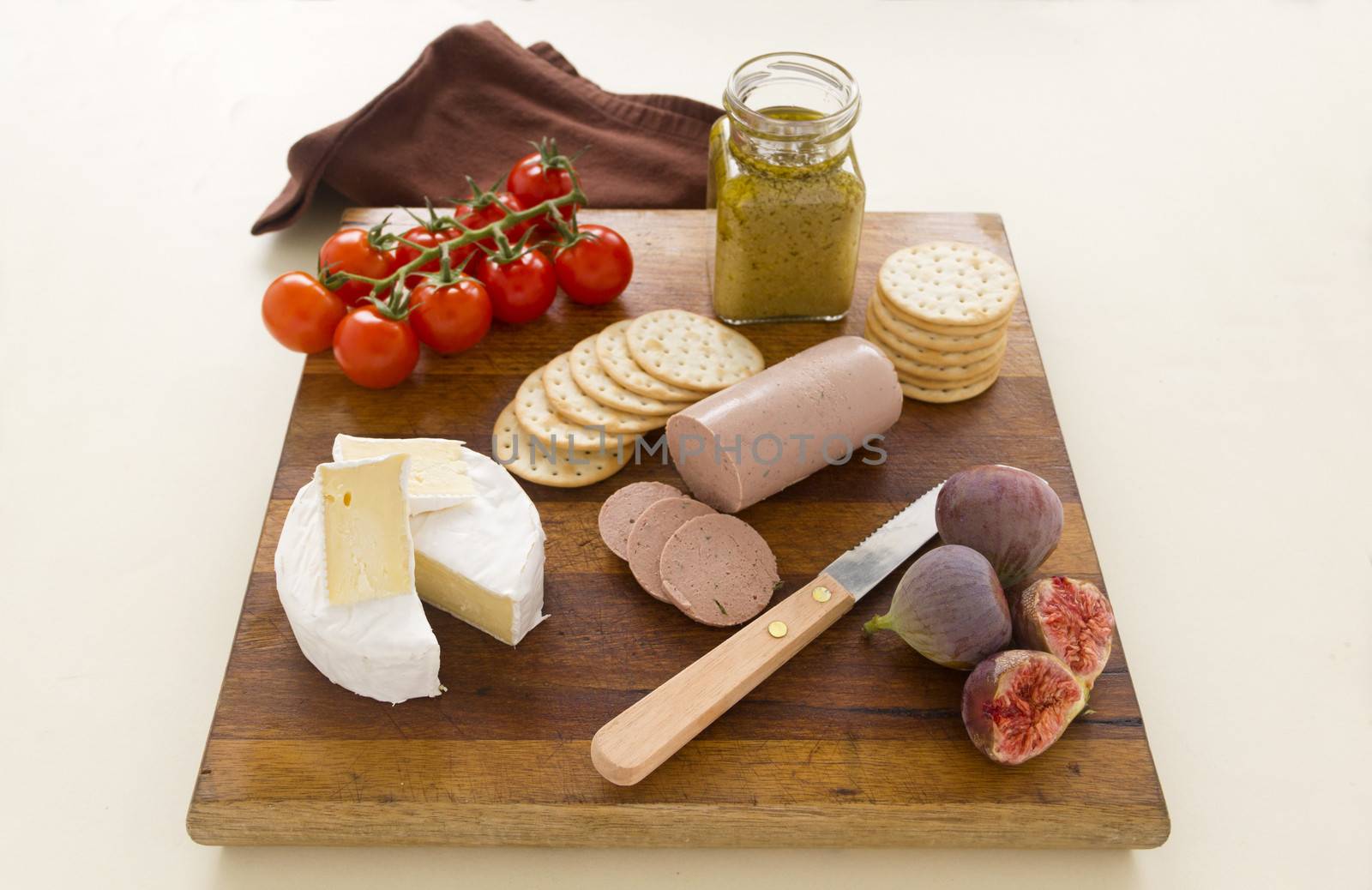 Delicious liverwurst and camembert cheese with fresh figs and cherry tomatoes.