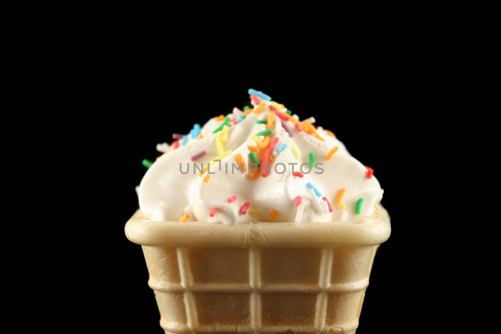Sweet marshmallow cone with colored cake sprinkles.
