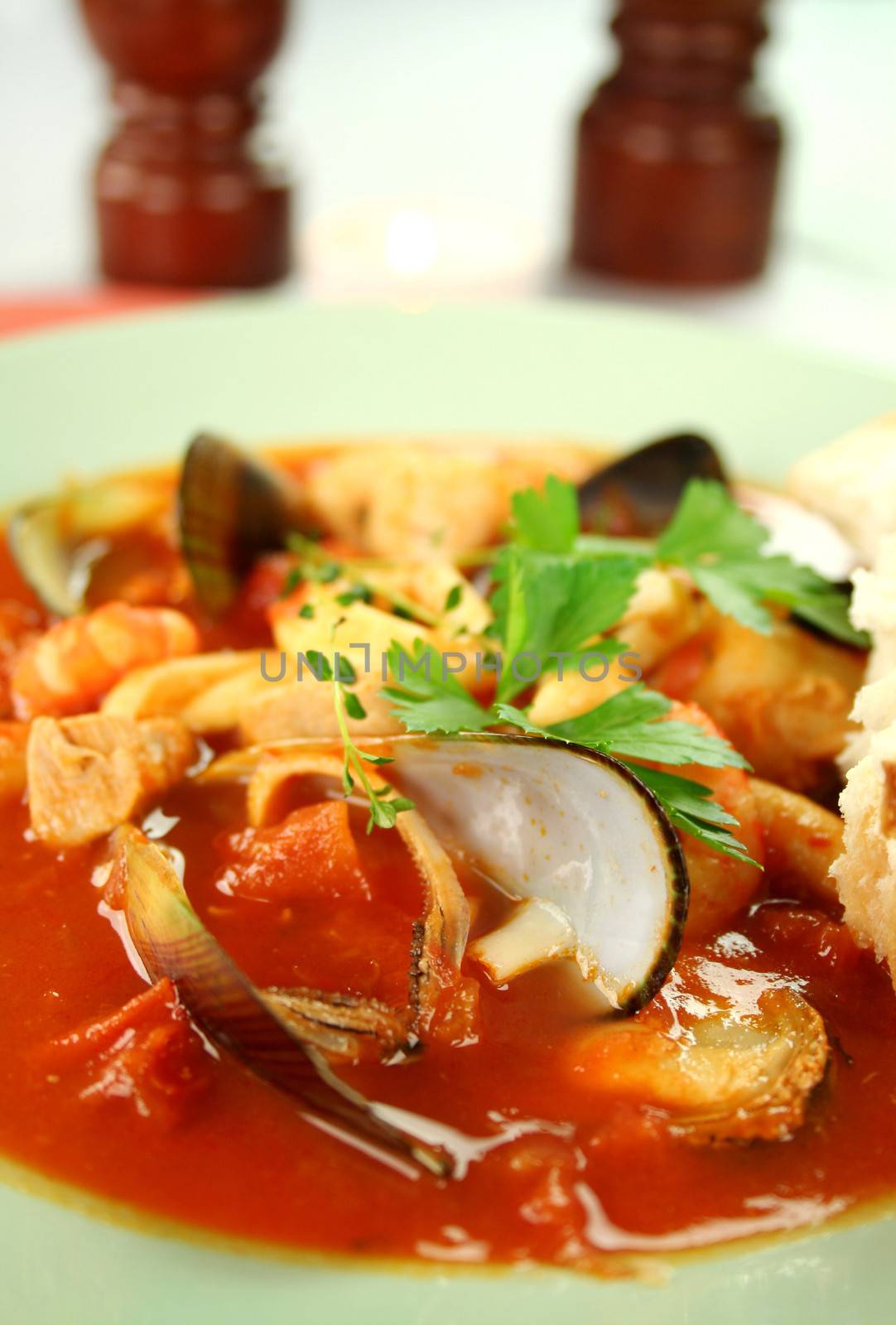 Delicious Mediterranean style tomato seafood soup with a variety of mixed seafood.