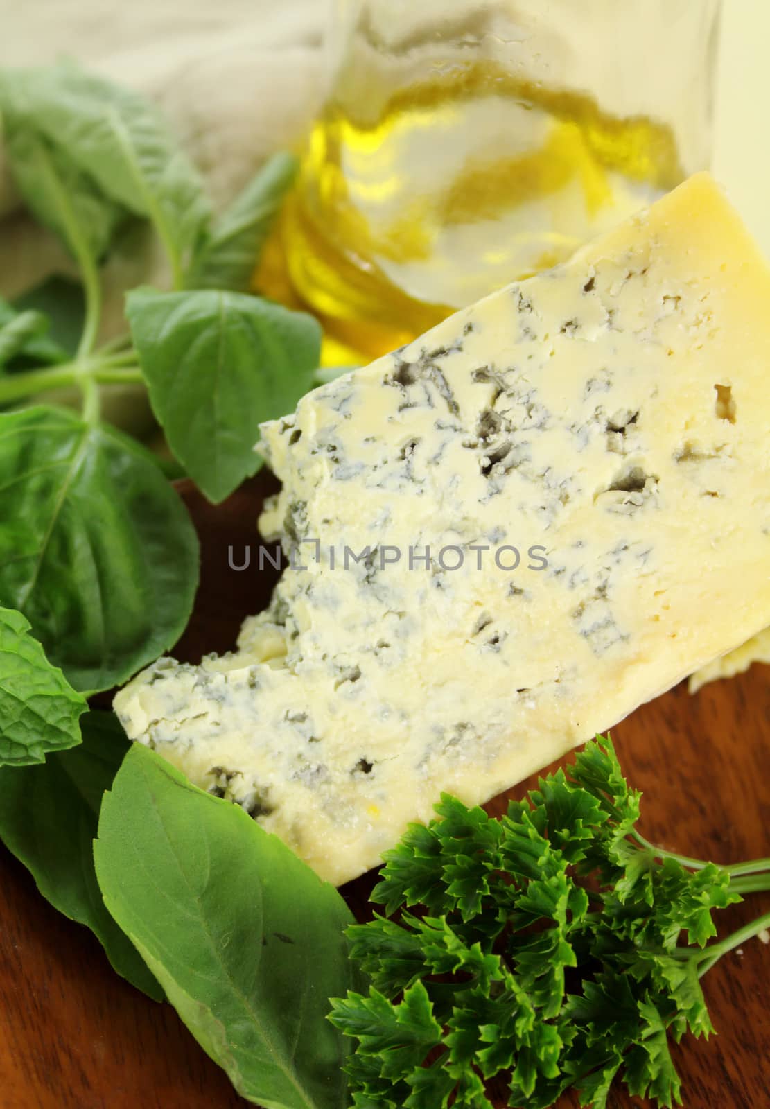 Delicious blue cheese with mixed leaf salad and olive oil.