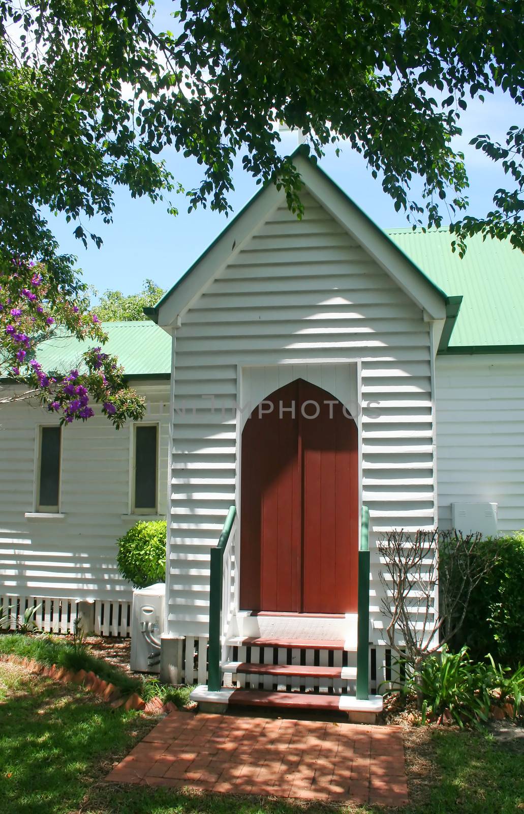 Entrance to an historic old church witha beautiful garden.