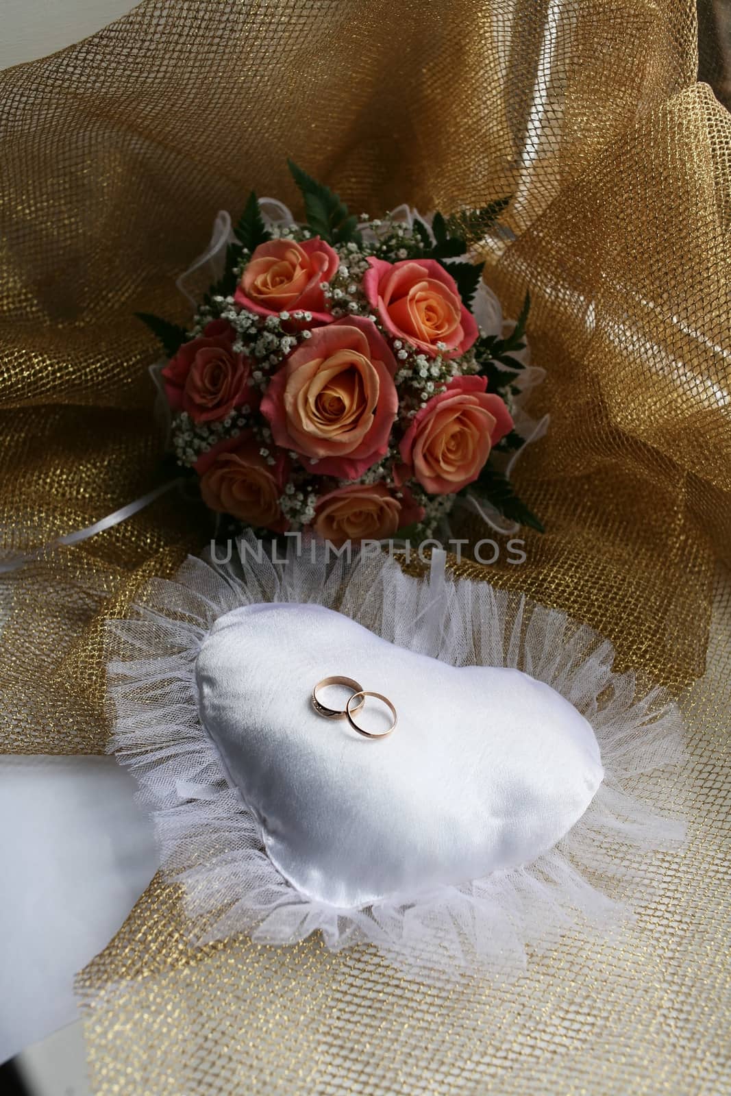 Wedding rings and bouquet by Krakatuk