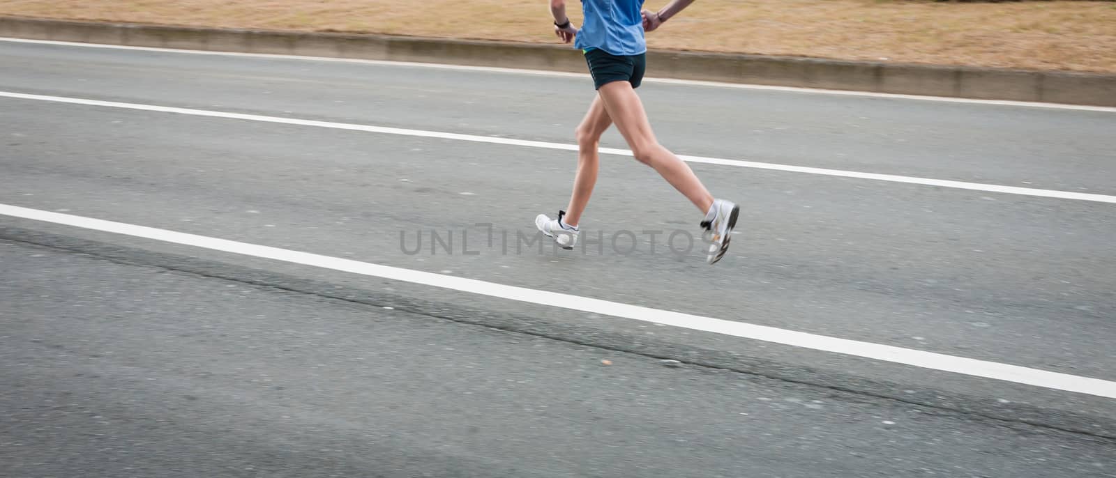 Marathon runners on the Road. Motion blurred