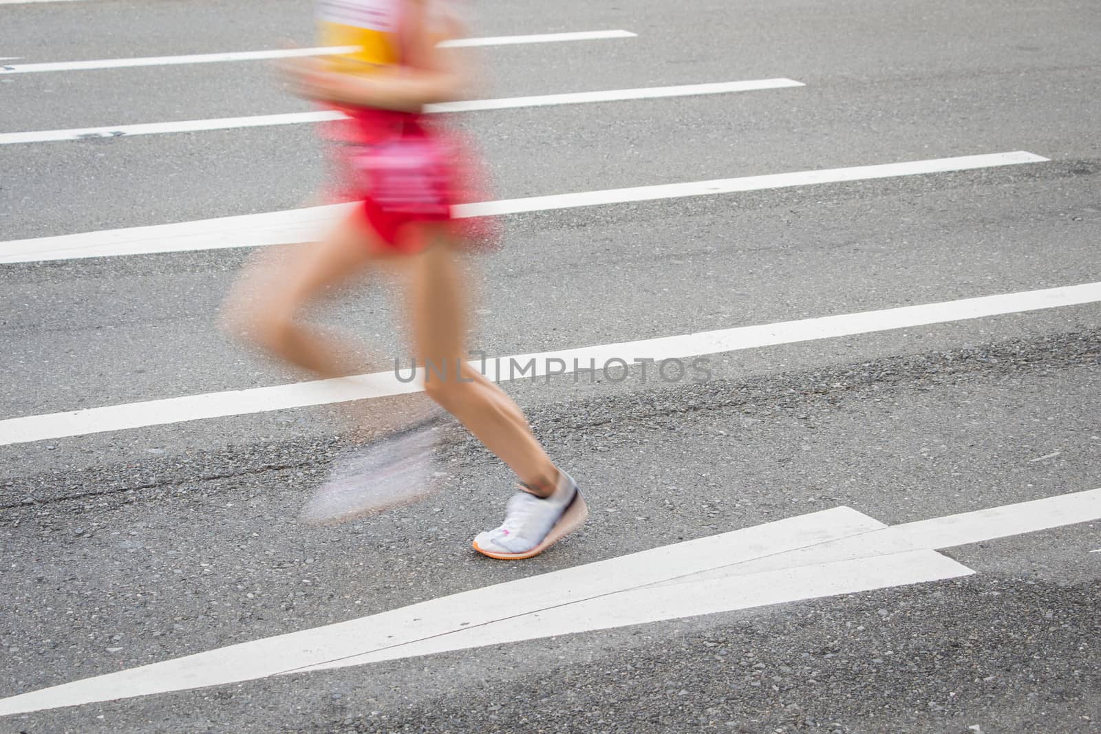 Marathon runners on the Road. Motion blurred