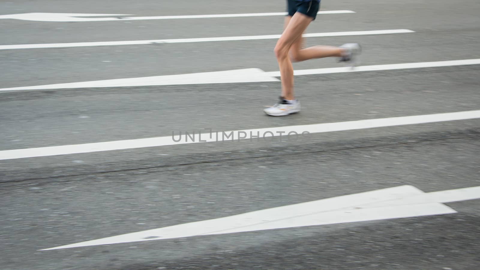 Marathon runners on the Road. Motion blurred