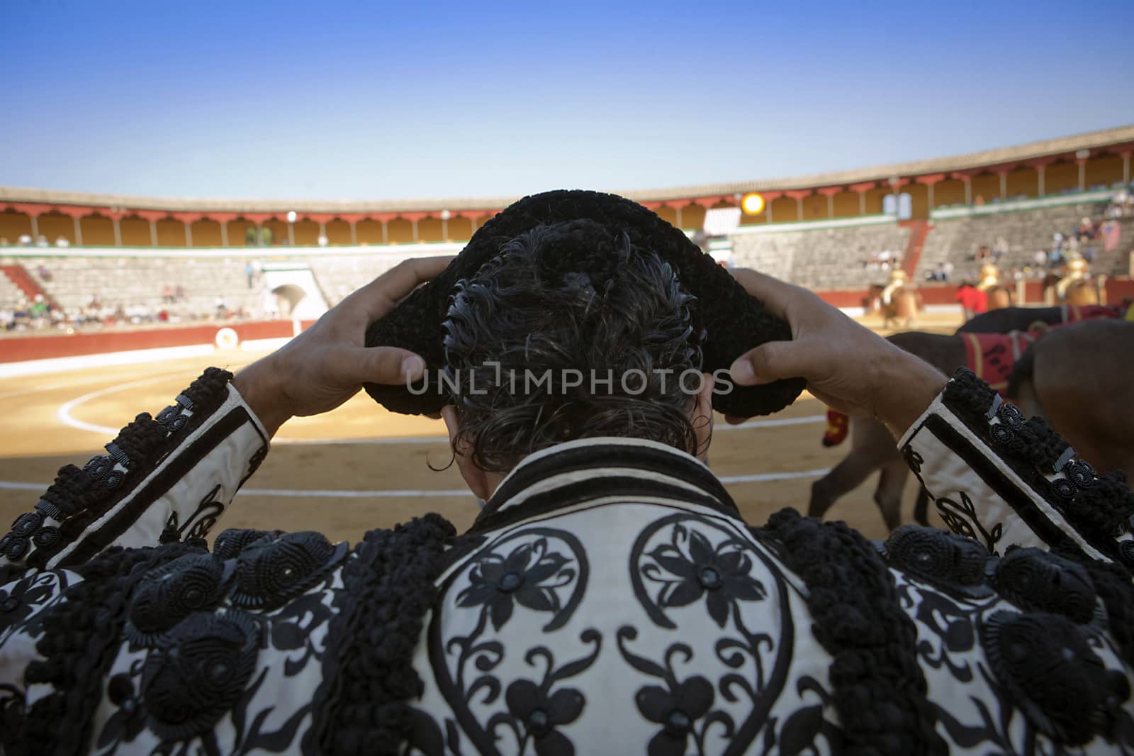 Bullfighter by contacting the montera during a bullfight, Spain