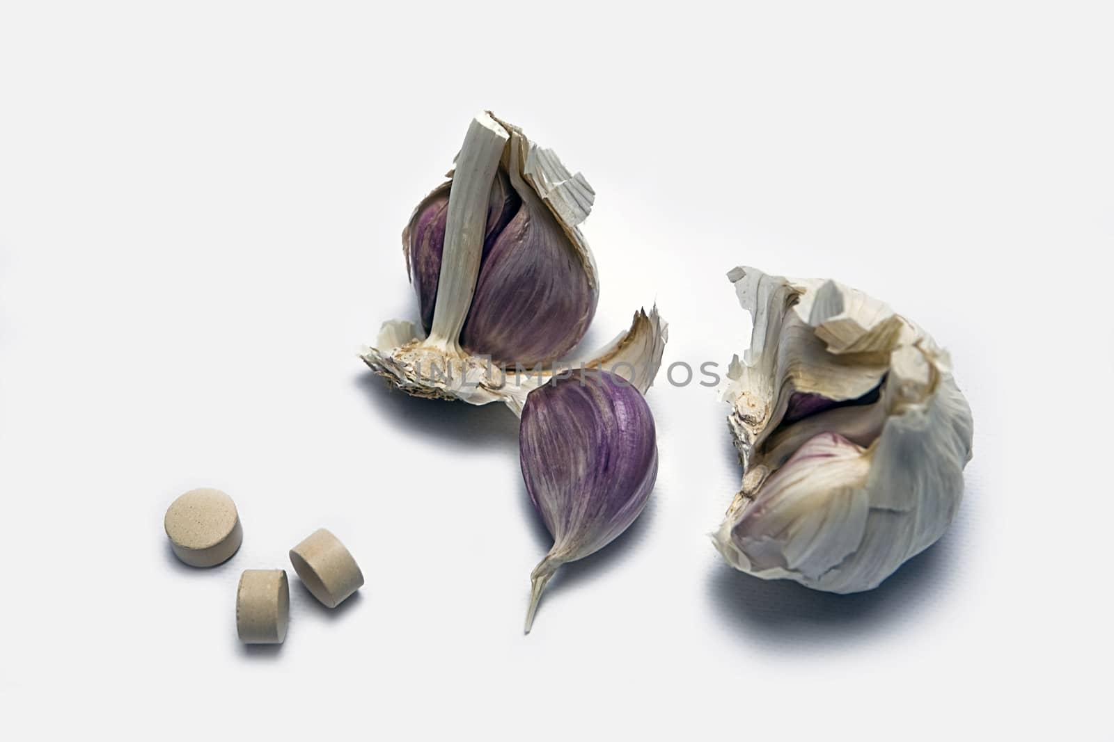 Garlic and herbal supplement pills, alternative medicine concept