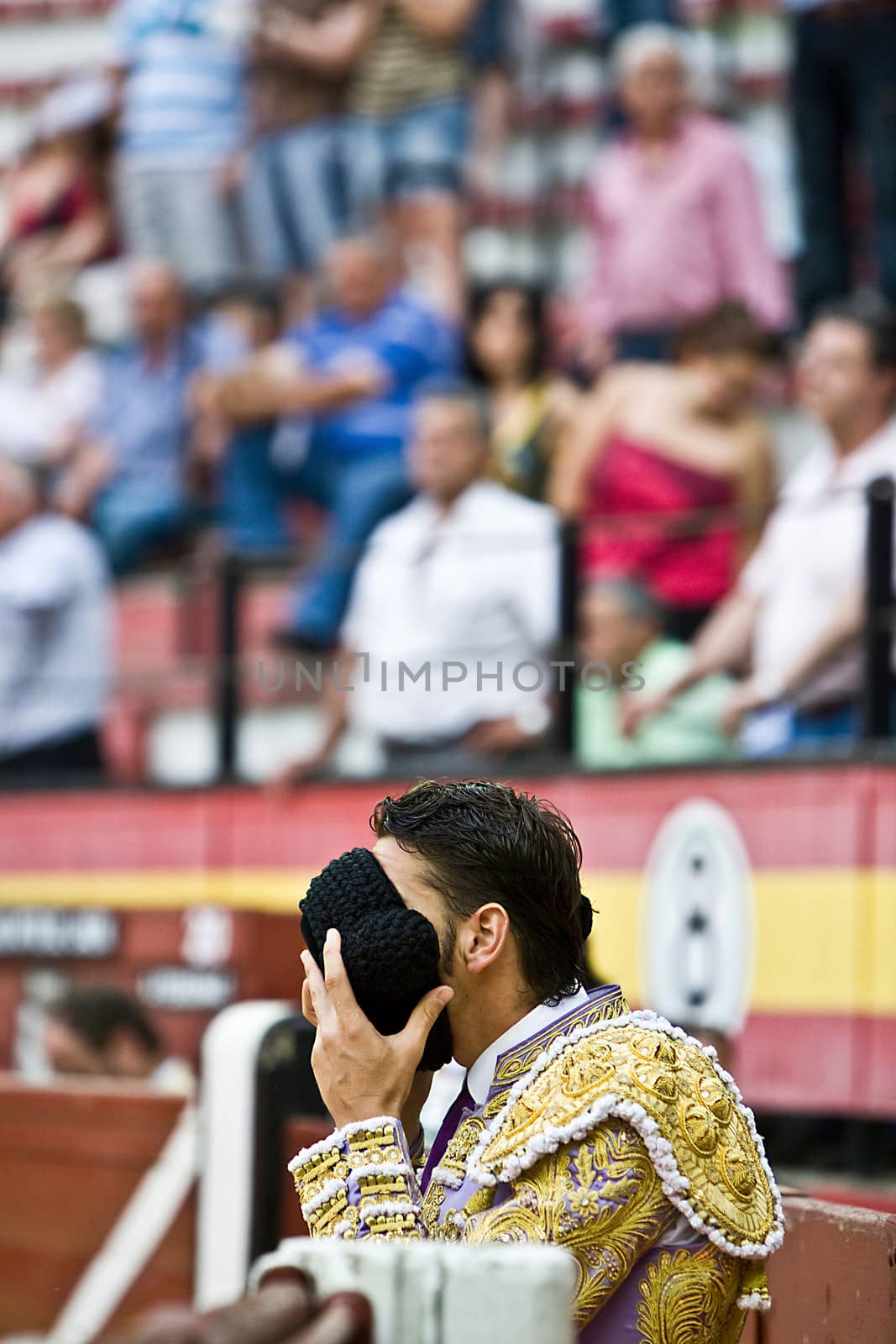 Bullfighter praying with his montera, Jaen, Spain