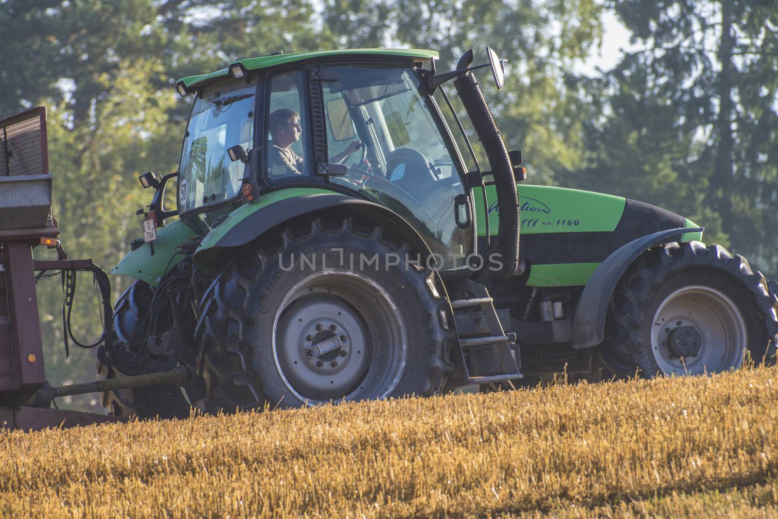farmer fertilizing the field by steirus
