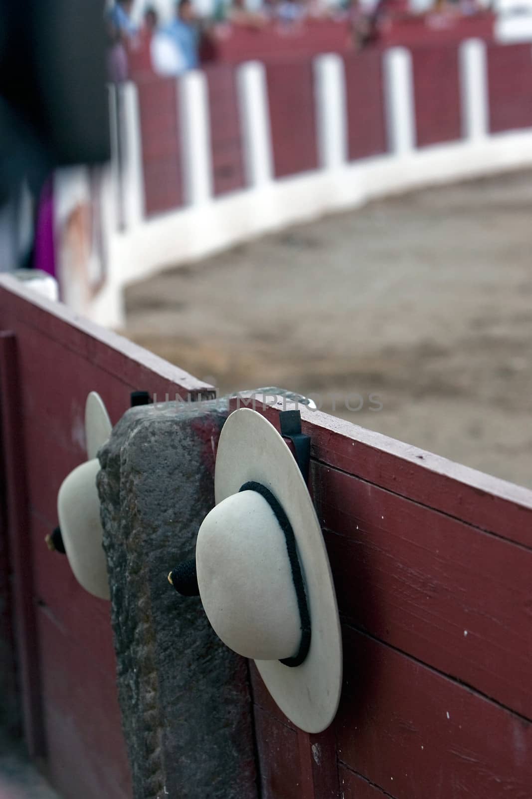 A castoreno (the picador's rounded hat) hanging from the barrier during a bullfight. Linares, province of Jaen, Spain, 30th august 2011
