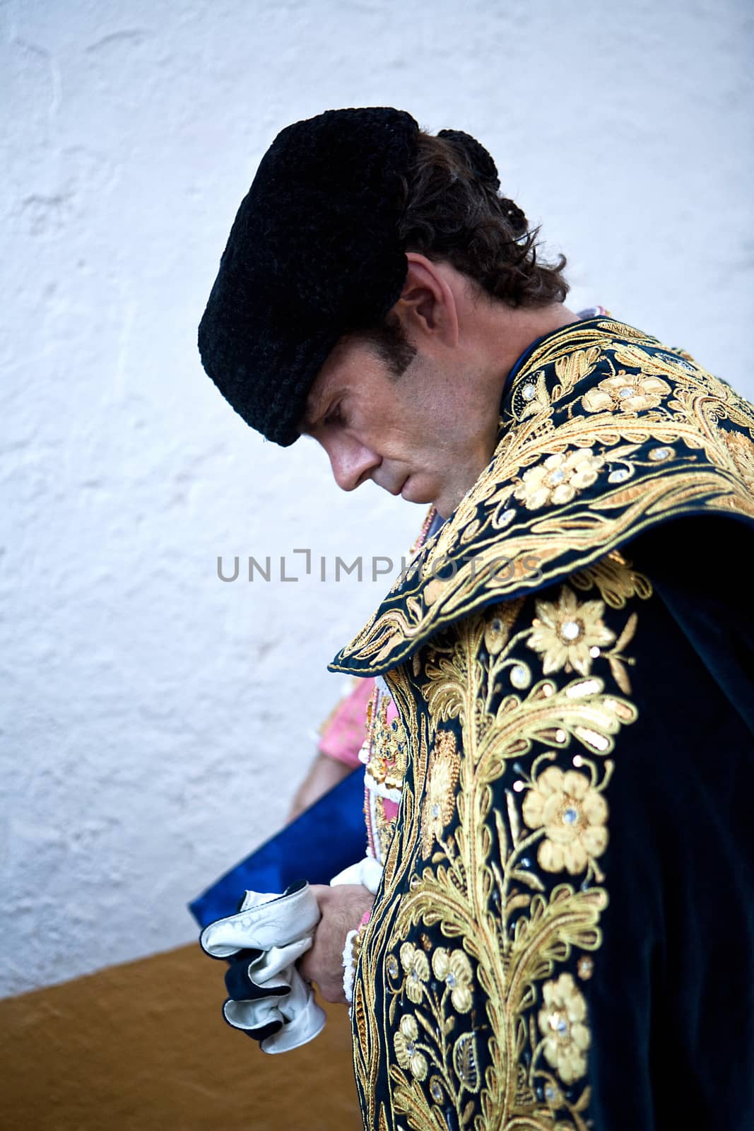 The spanish bullfigher Jose Tomas getting dressed for the paseillo or initial parade. Taken at Linares bullring before a bullfight, Linares, Spain, 29 august 2011