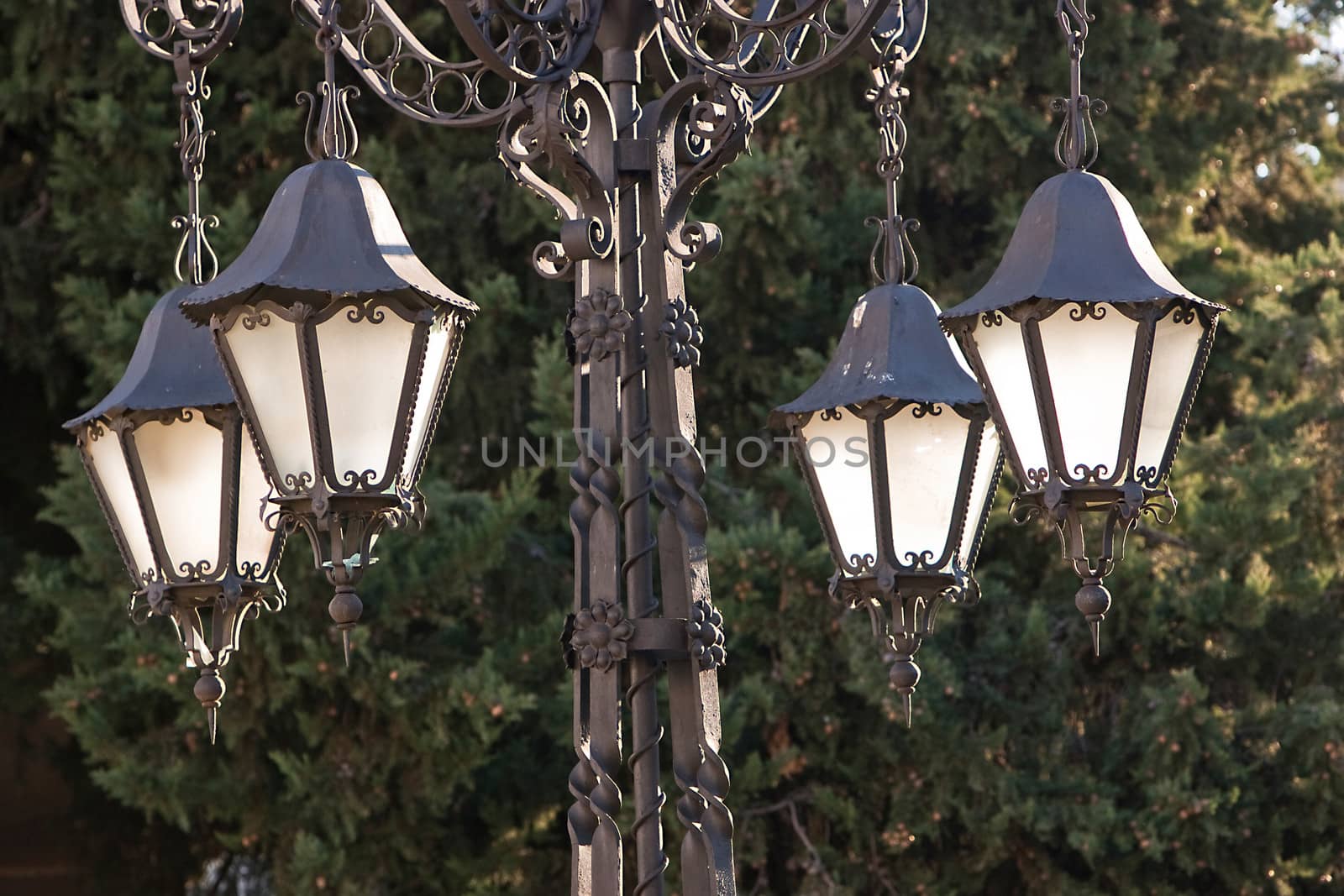 A wrought iron lamp on a weathered wall in 1 First of May Square, Ubeda, province of Jaen, Spain