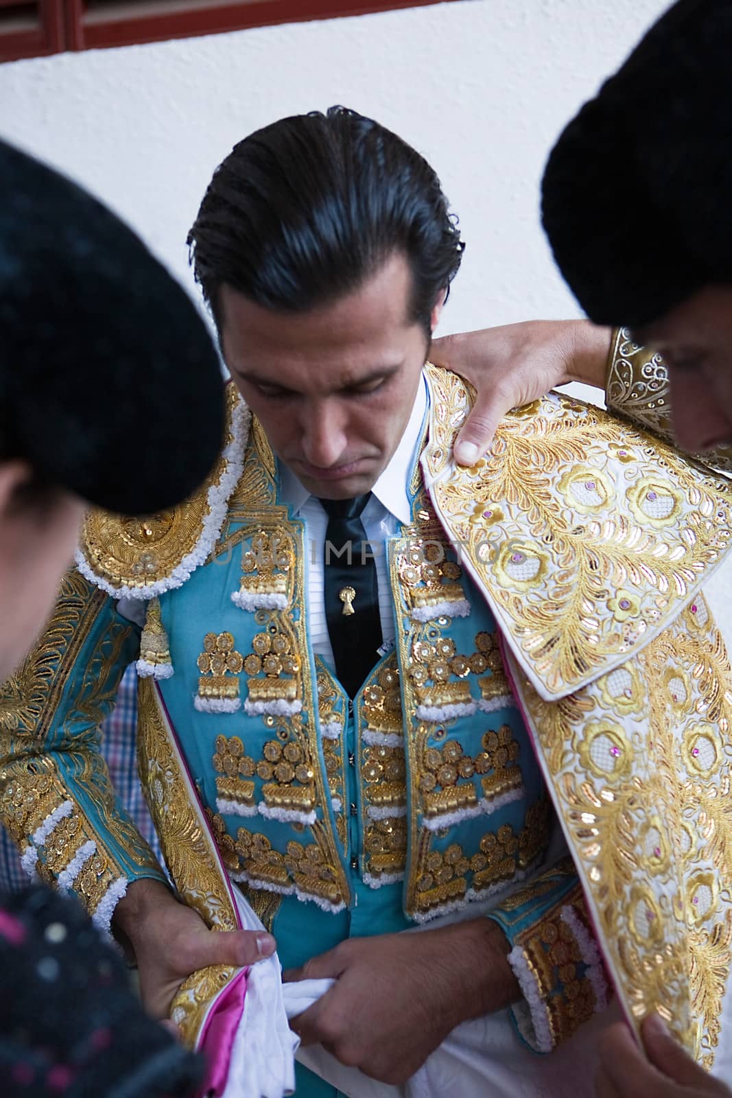 The spanish bullfighter David Mora  getting dressed for the paseillo or initial parade. Taken at Linares bullring before a bullfight, Jaen, Andalusia, Spain, 16 october 2011