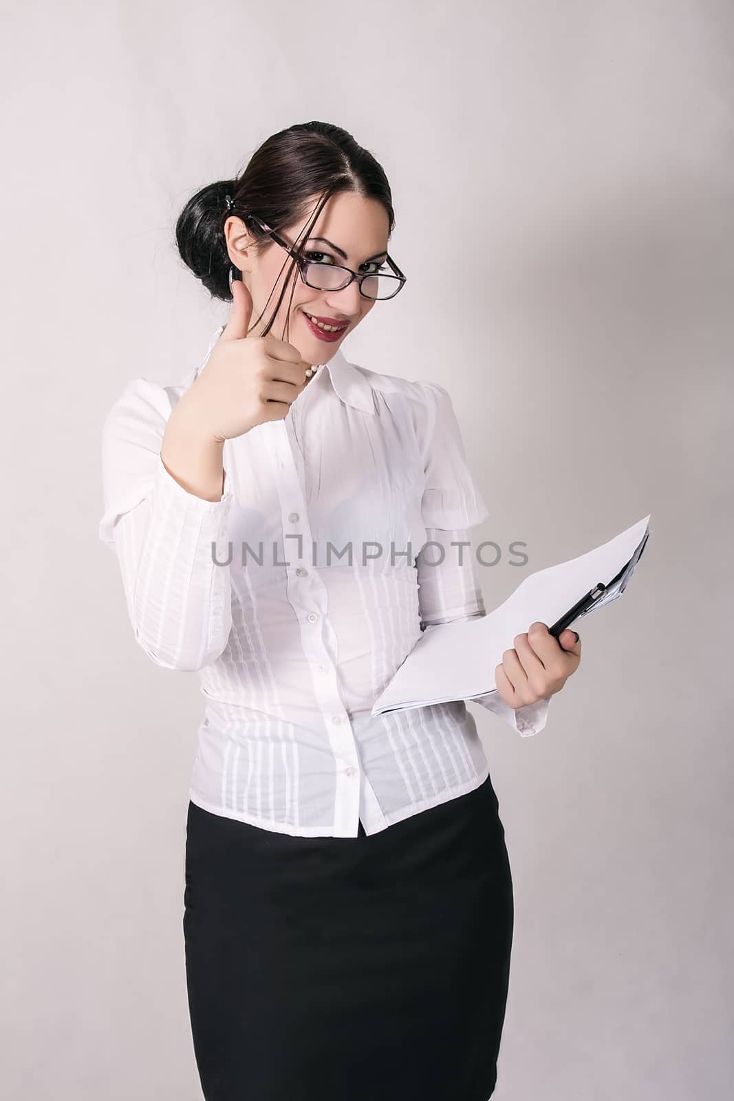 portrait of attractive secretary holding papers