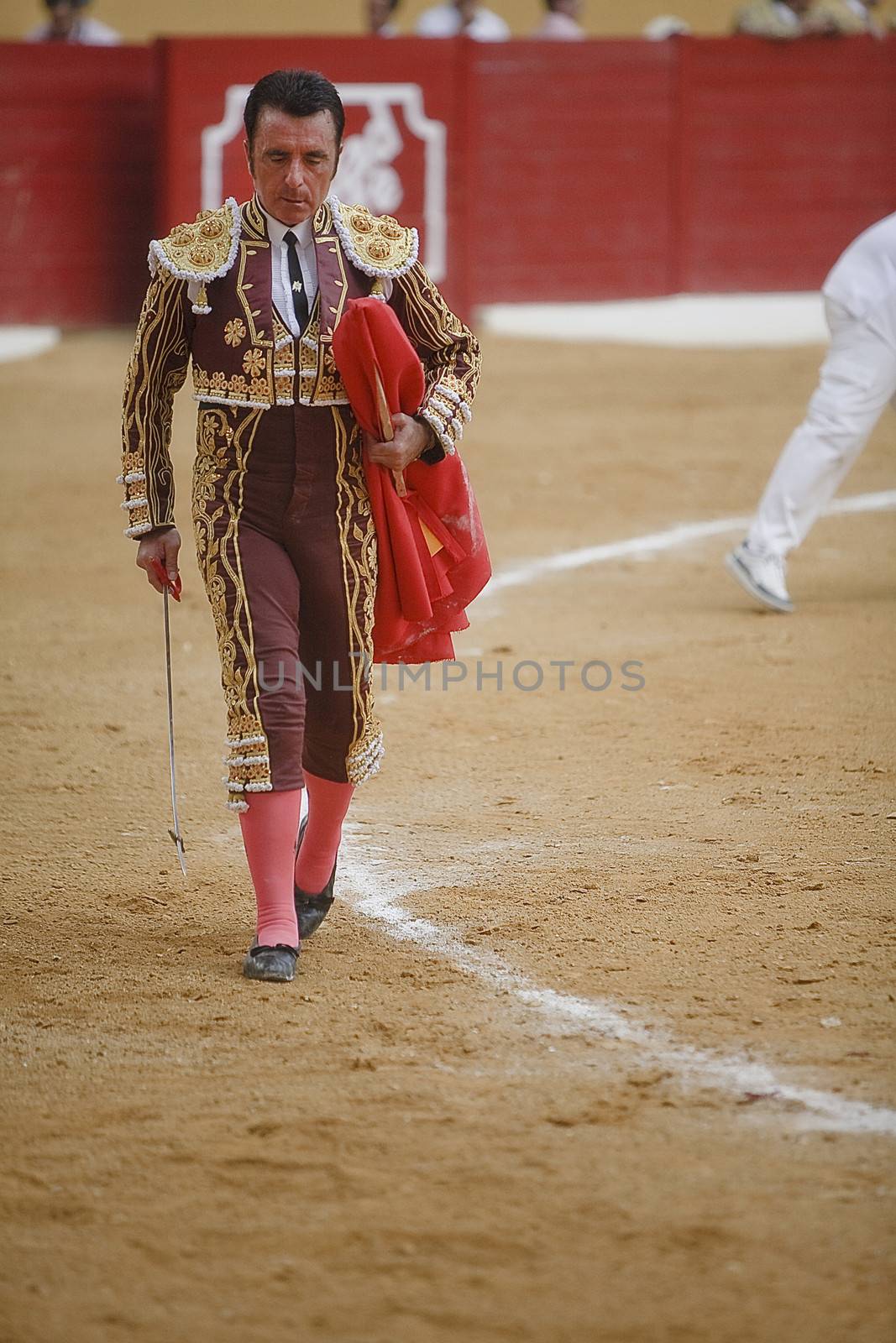 The spanish bullfighter with the Cape in the Bullfight in Atarfe coliseum, Atarfe, Granada province, Spain 25 july 2009