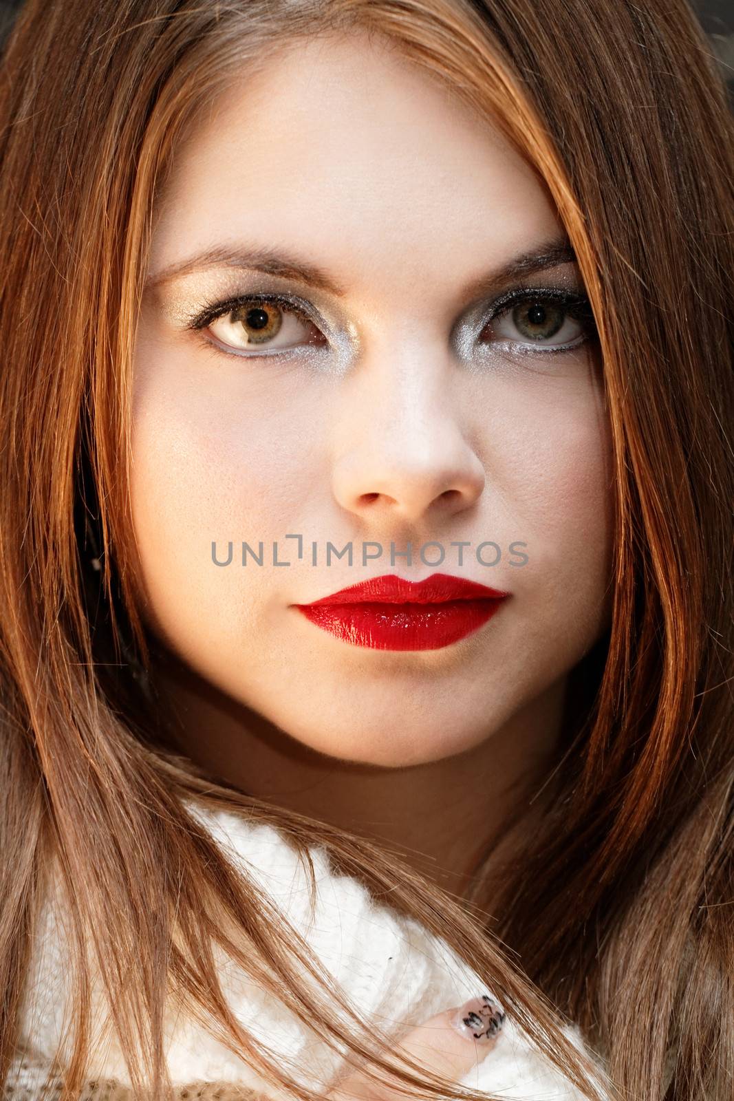 Friendly smiling young woman portrait studio shot