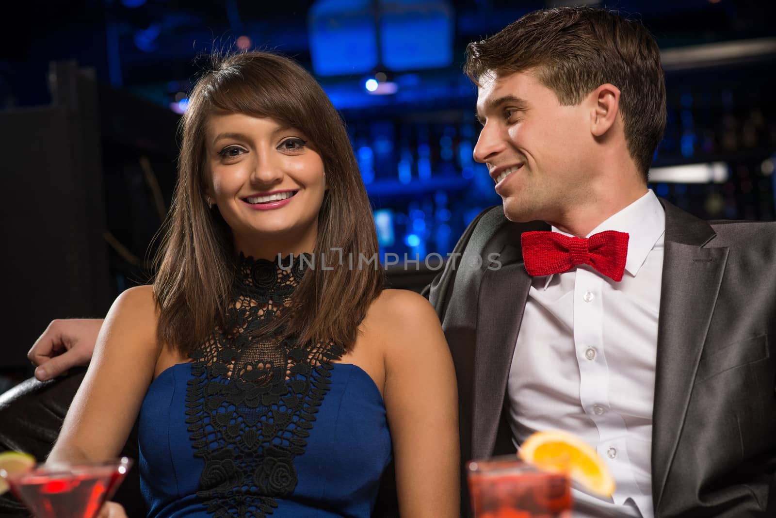 Young couple talking in a nightclub by adam121