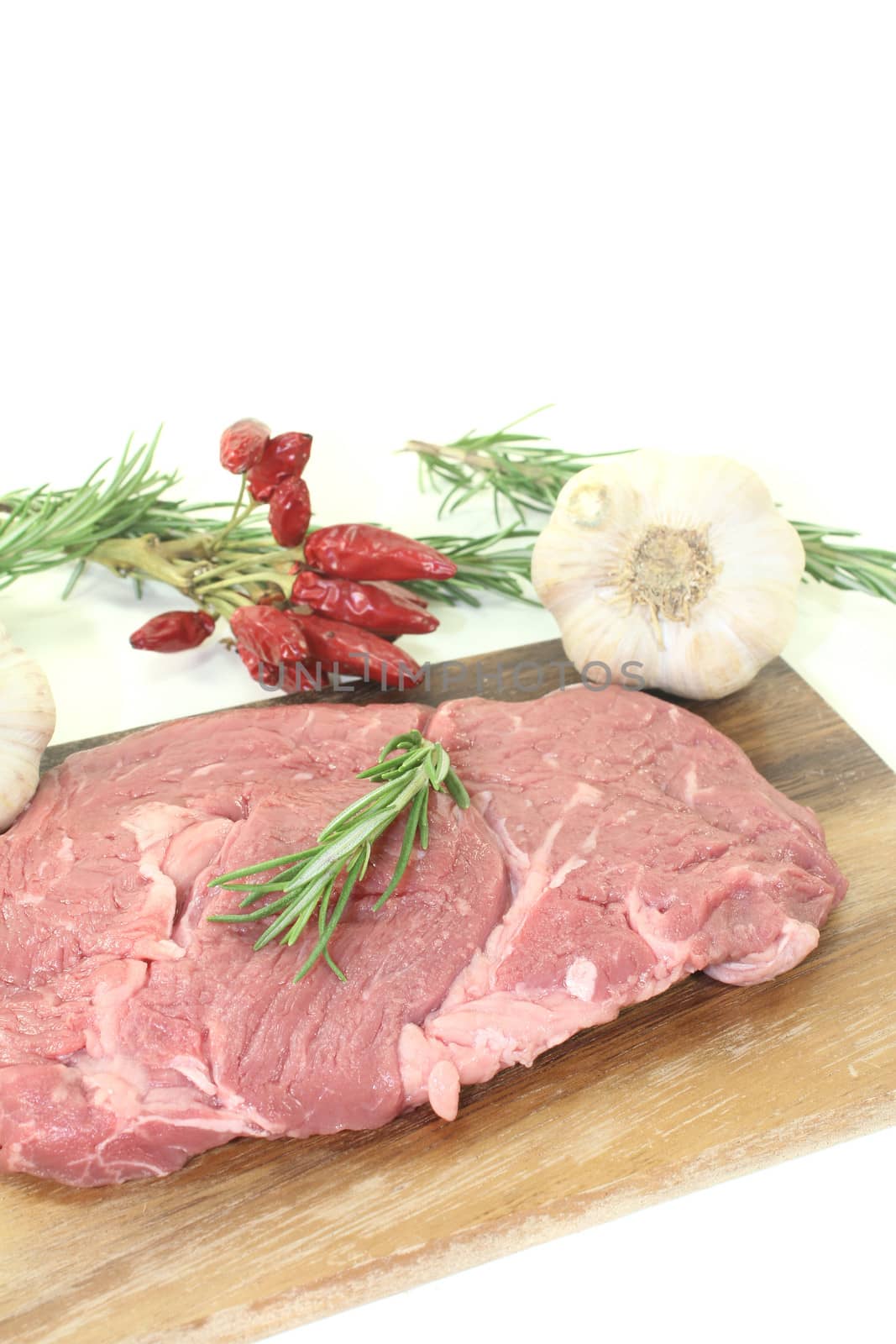Ribeye steak with garlic, chilli and rosemary by discovery